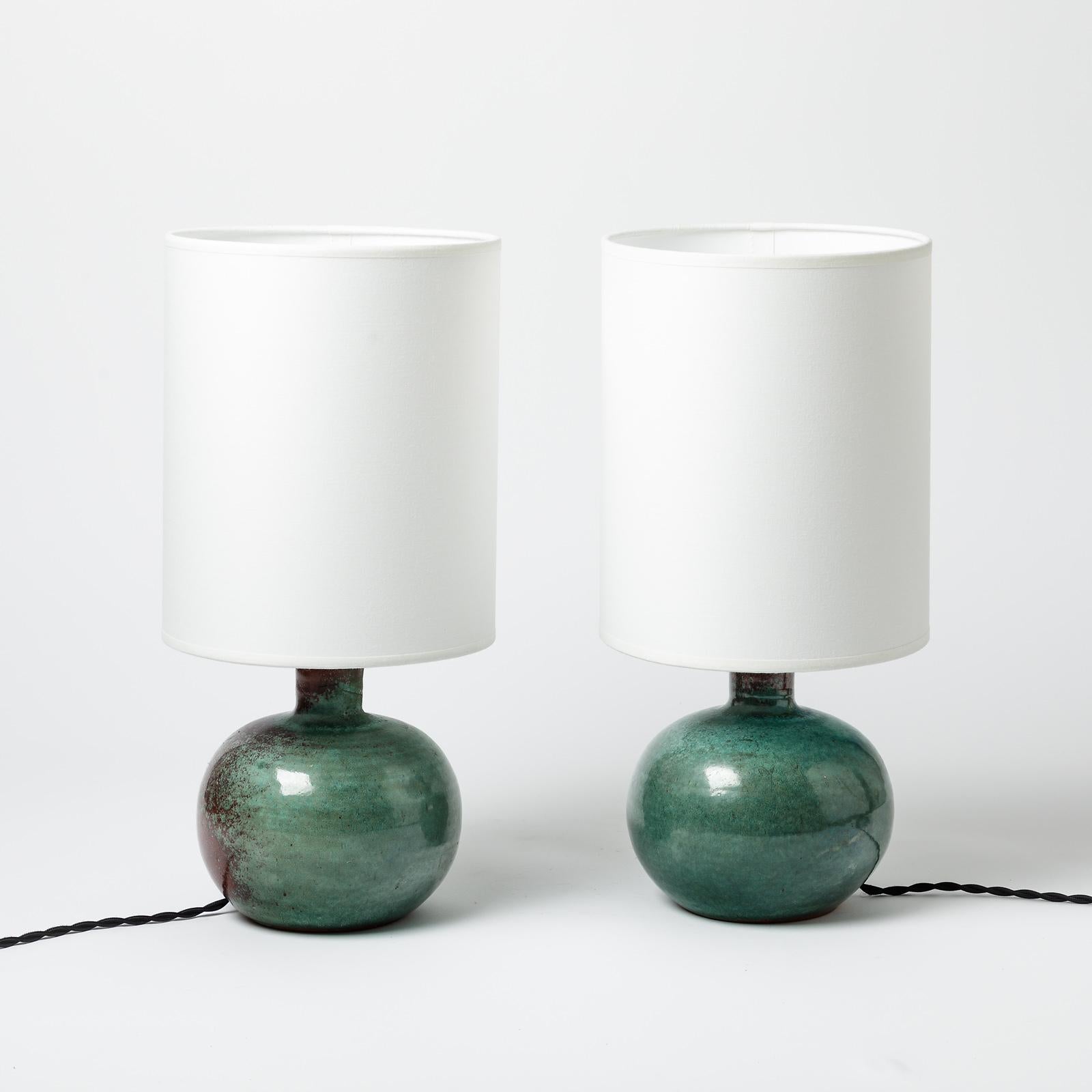 A pair of ceramic table lamps with green and red glaze decoration by La Borne Potters.
Sold with a new lamp shaded new european electrical system
Perfect original conditions.
Signed under the base.
Circa 1960-1970.
Dimensions :
- Ceramic only