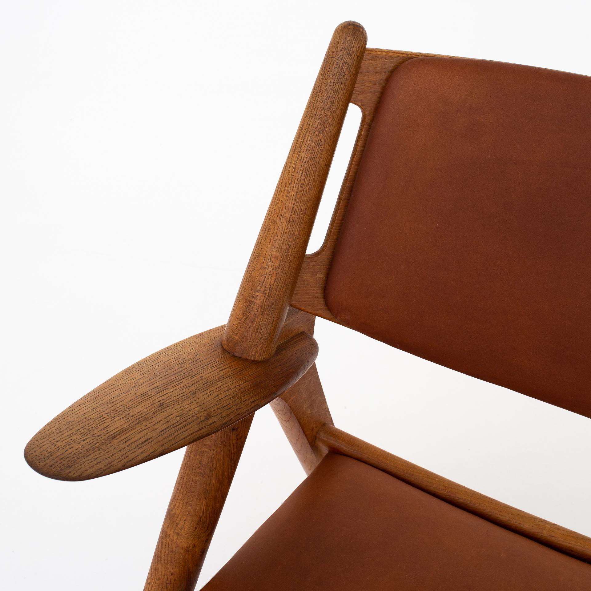 Patinated Pair of CH 28 Easy Chairs by Hans J. Wegner