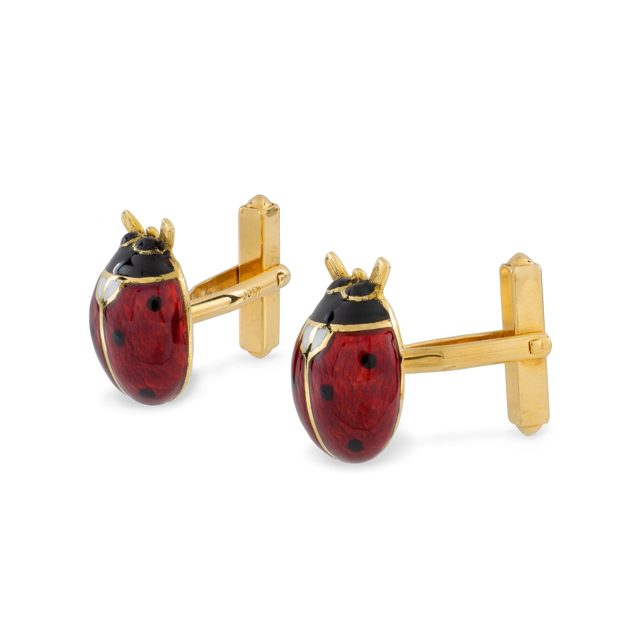 A pair of champleve enamel ladybird cufflinks, each with red, black and white enamelled body, all to a yellow gold mount with post fittings, hallmarked 18ct gold London, made by Bentley & Skinner, each ladybird measuring approximately 1.8 x 1.2cm,
