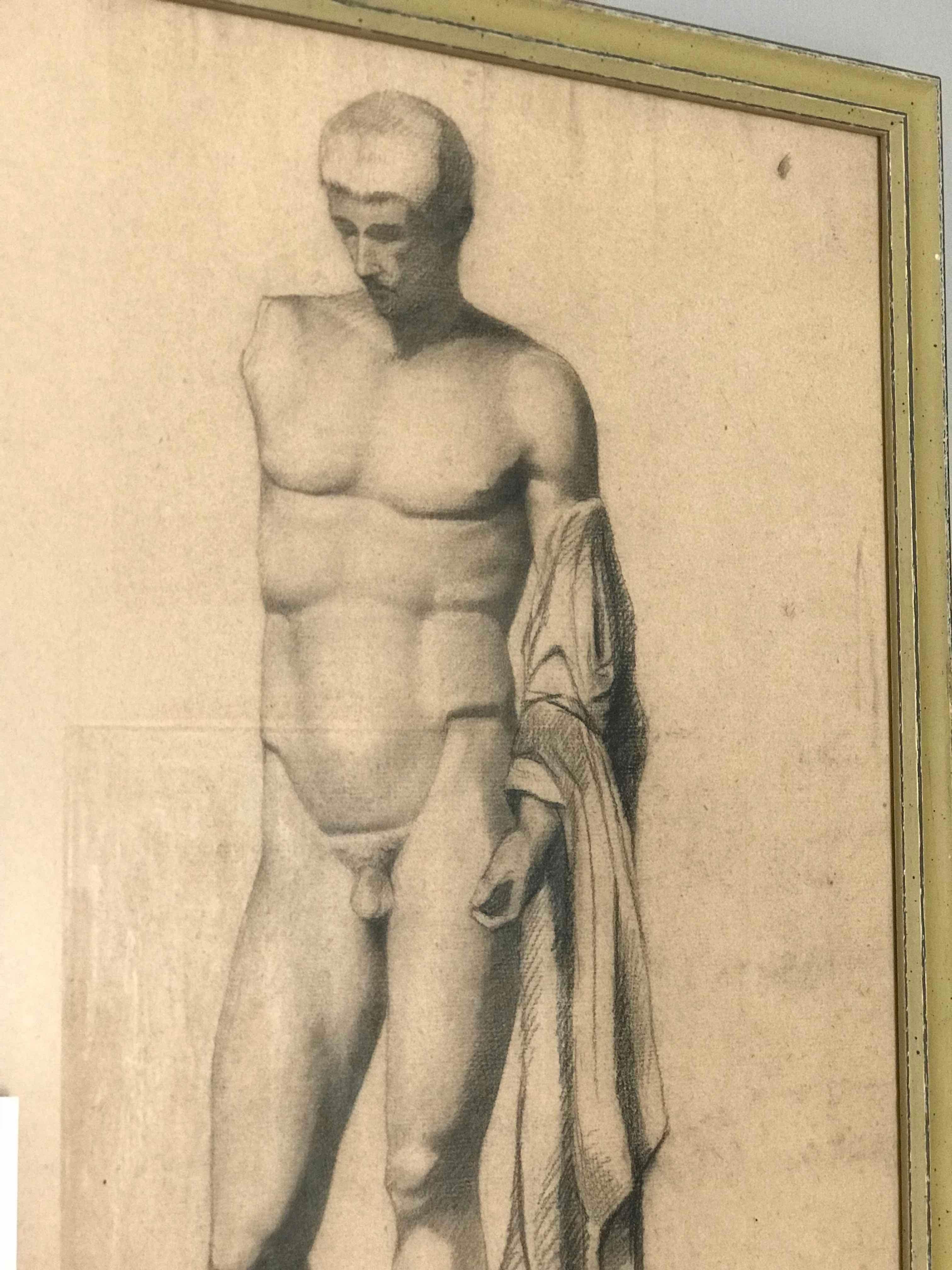 Pair of late 19th-century neoclassical charcoal drawings of a Greek or Roman nude male sculpture in the French Academy style. Not unlike Michelangelo's famous David, the finely built figure gazes into another world, his stance, an exquisitely