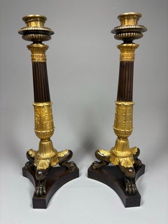 A pair of Charles X or Louis-Philippe neoclassical bronze candlesticks