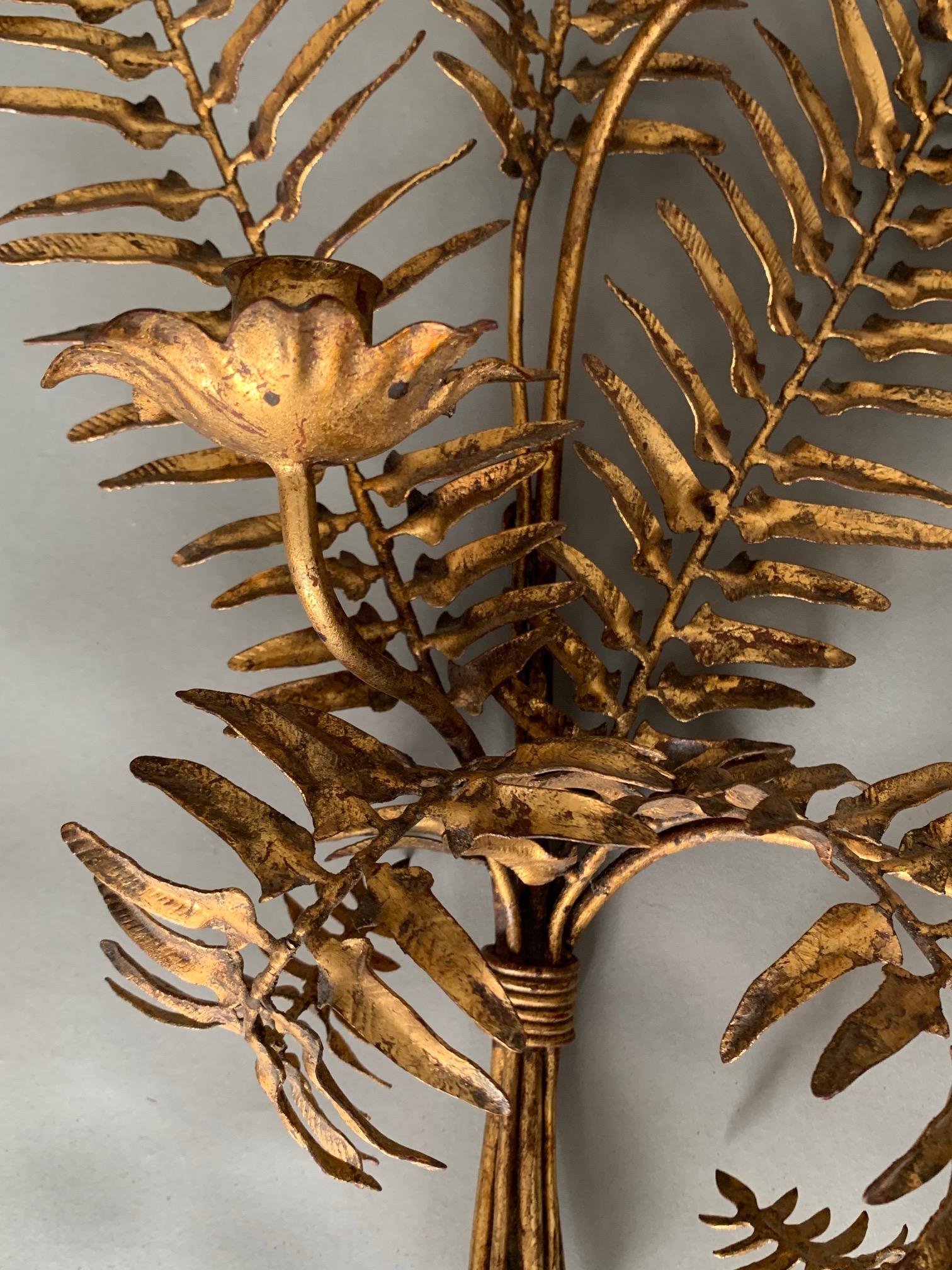 A pair of charming Italian gilt metal sconces, with stylized leaf decoration, circa 1960s.