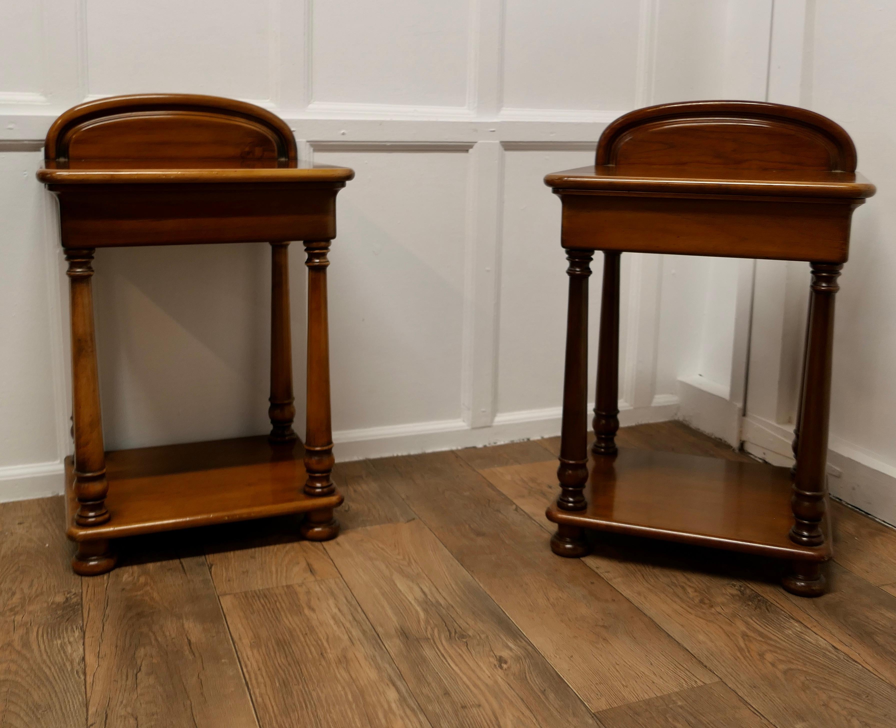 A Pair of Cherry Wood Night Tables Bedside Cabinet 

This is a superb heavy quality pair of bedside tables they each have a curved gallery to the table top and a large concealed drawer with an undertier beneath
The tables are in good condition