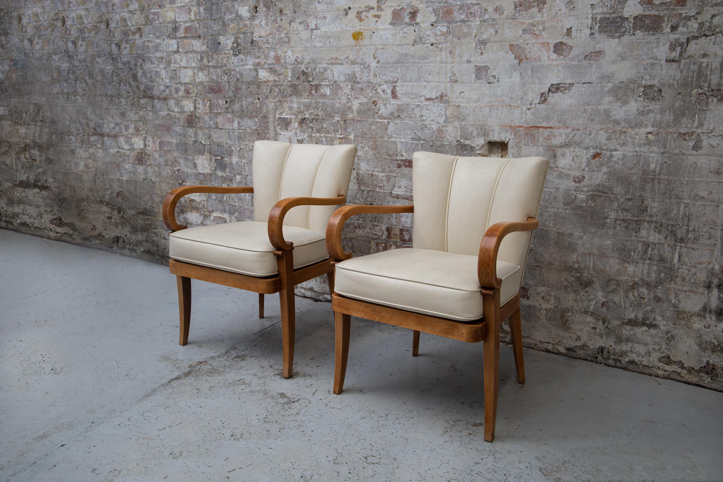 Exquisite form, patina and quality. With scroll arms, sabre legs and elliptical scalloped back.
Finished in Skai nappa faux leather.
   