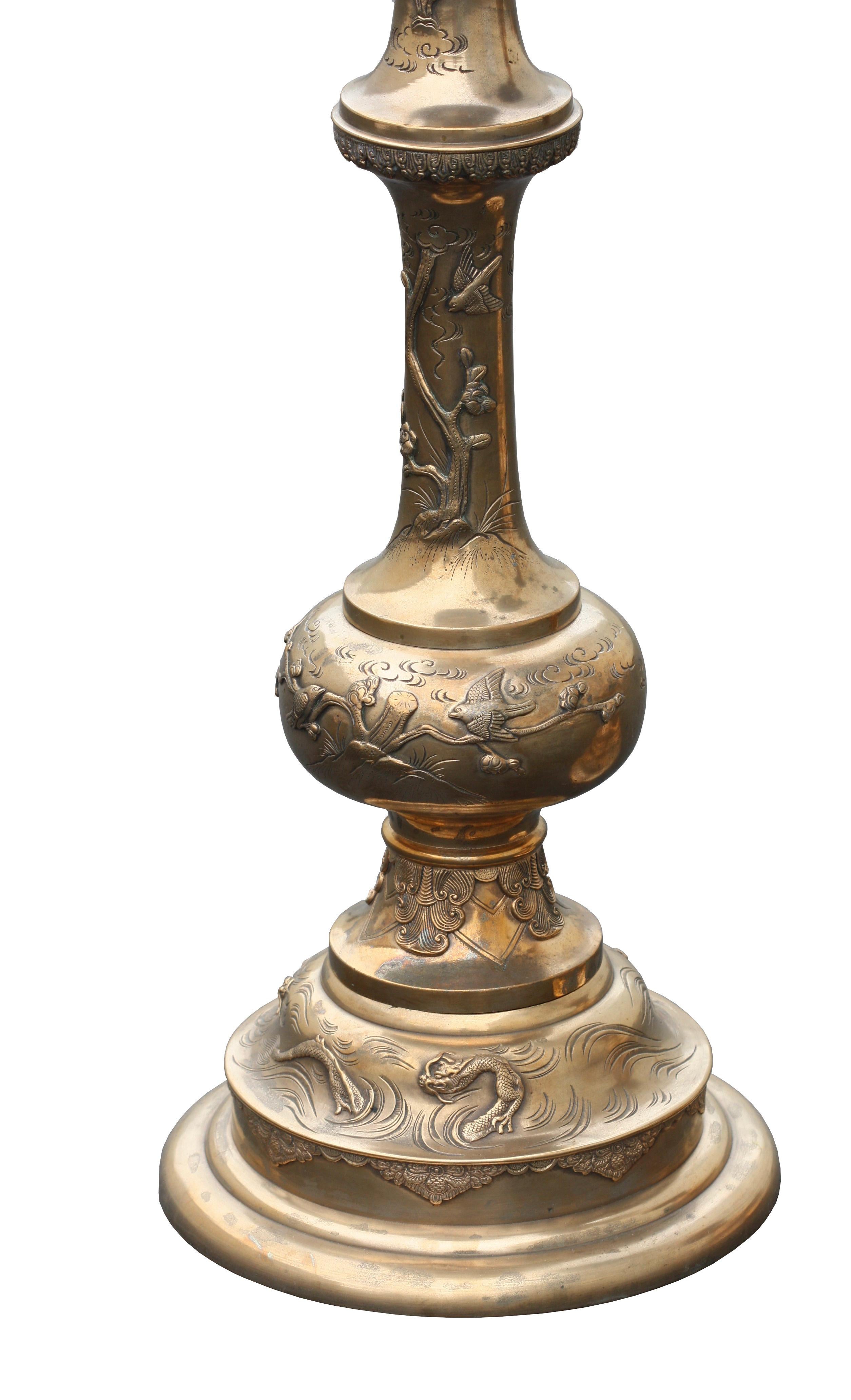 A pair of Chinese brass pedestal stands, 19/20th century
with pierced decoration
Measures: 90cm wide, 92cm high.