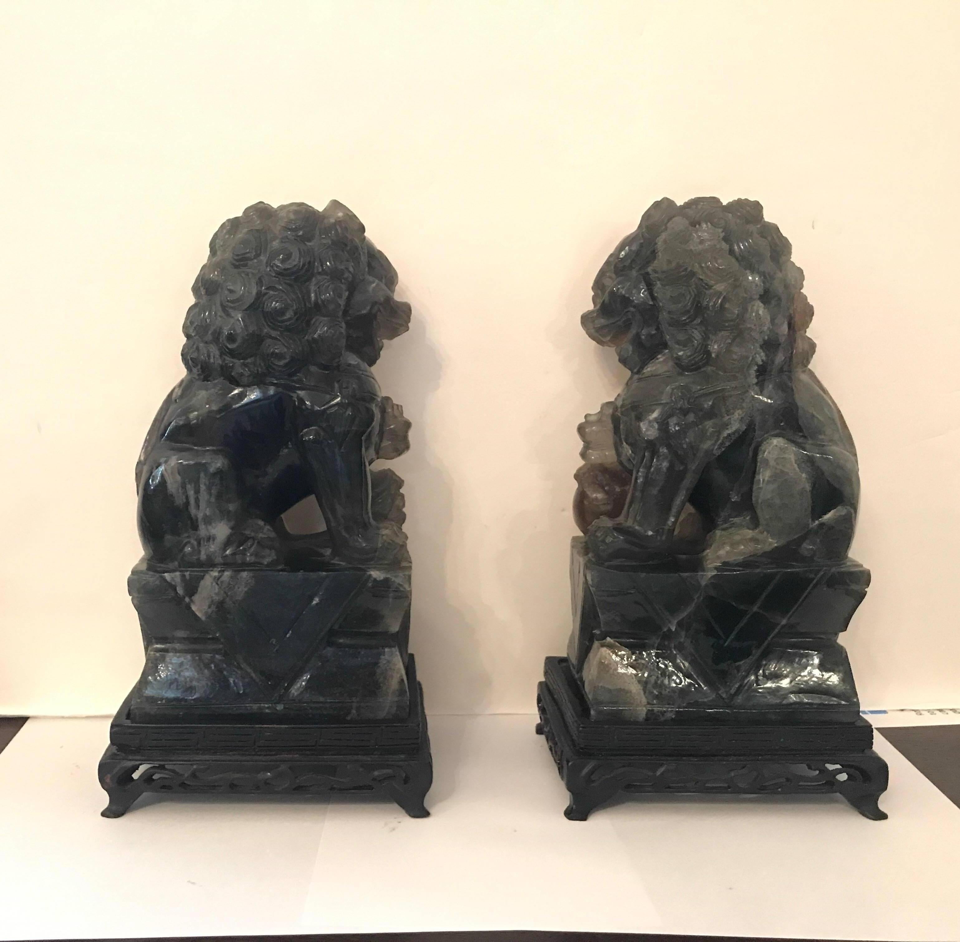 Early 20th Century Pair of Chinese Carved Green Quartz Foo Dogs