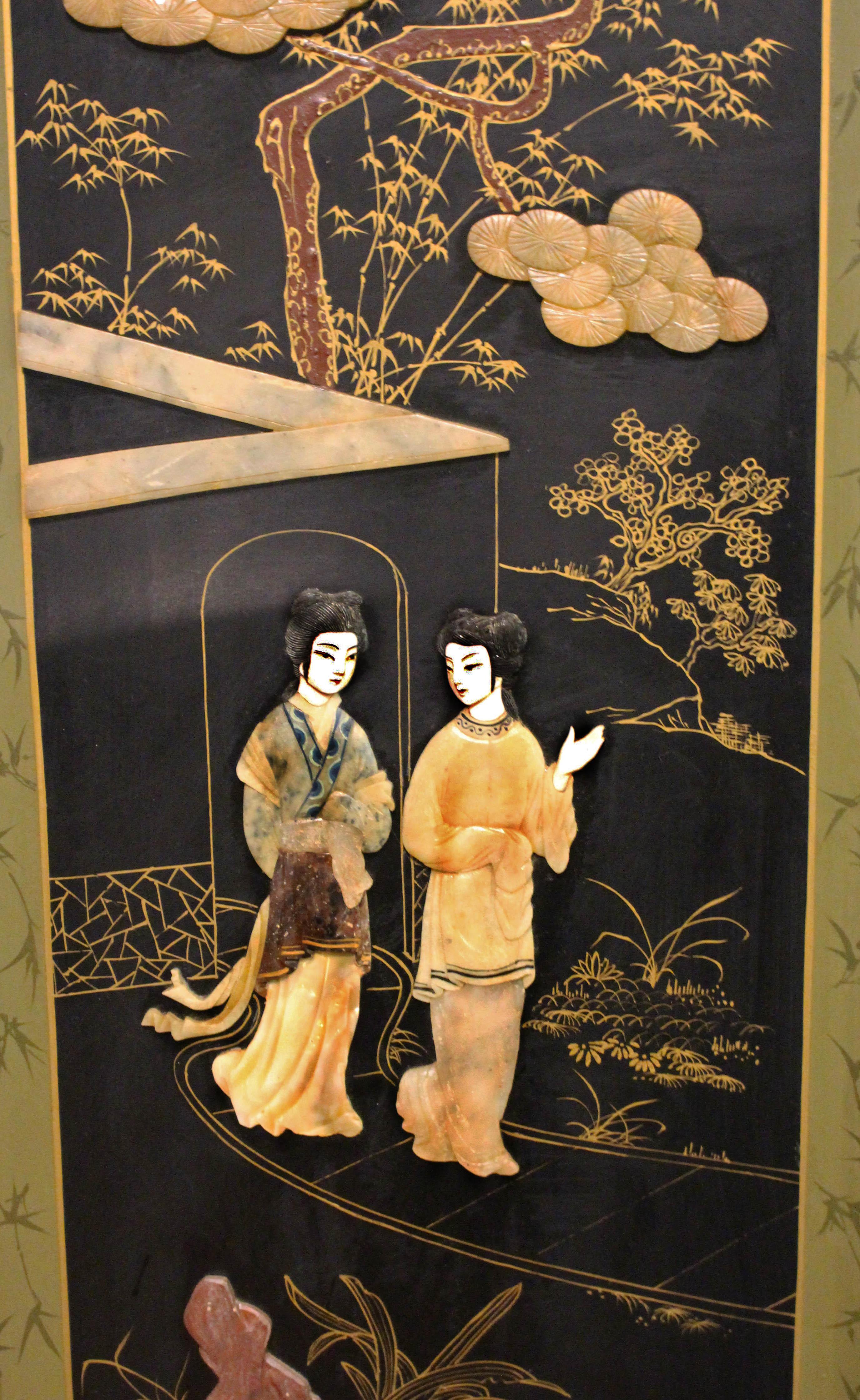 A pair of carved stone panels, Chinese, mid-20th century. Highly polished lacquer with cast brass hangers. 40 1/2