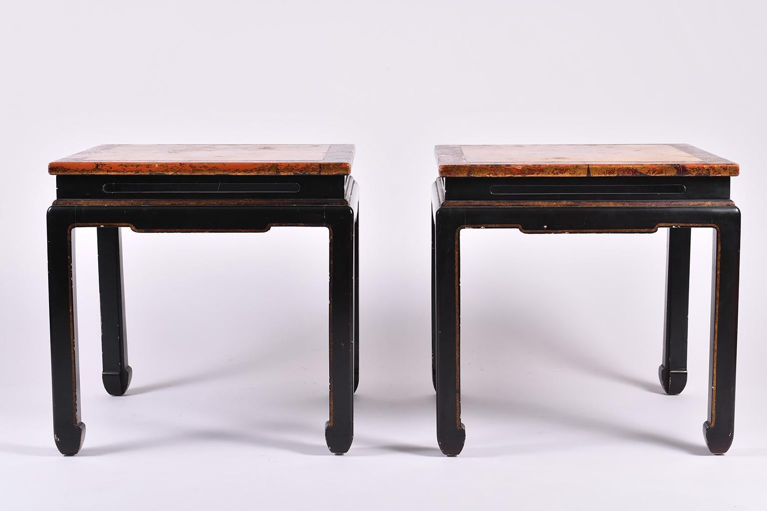 A pair of Chinese export black and red lacquer, gilded and painted top side tables
with open carved apron and stylized horse hoof feet
China, circa 1950.