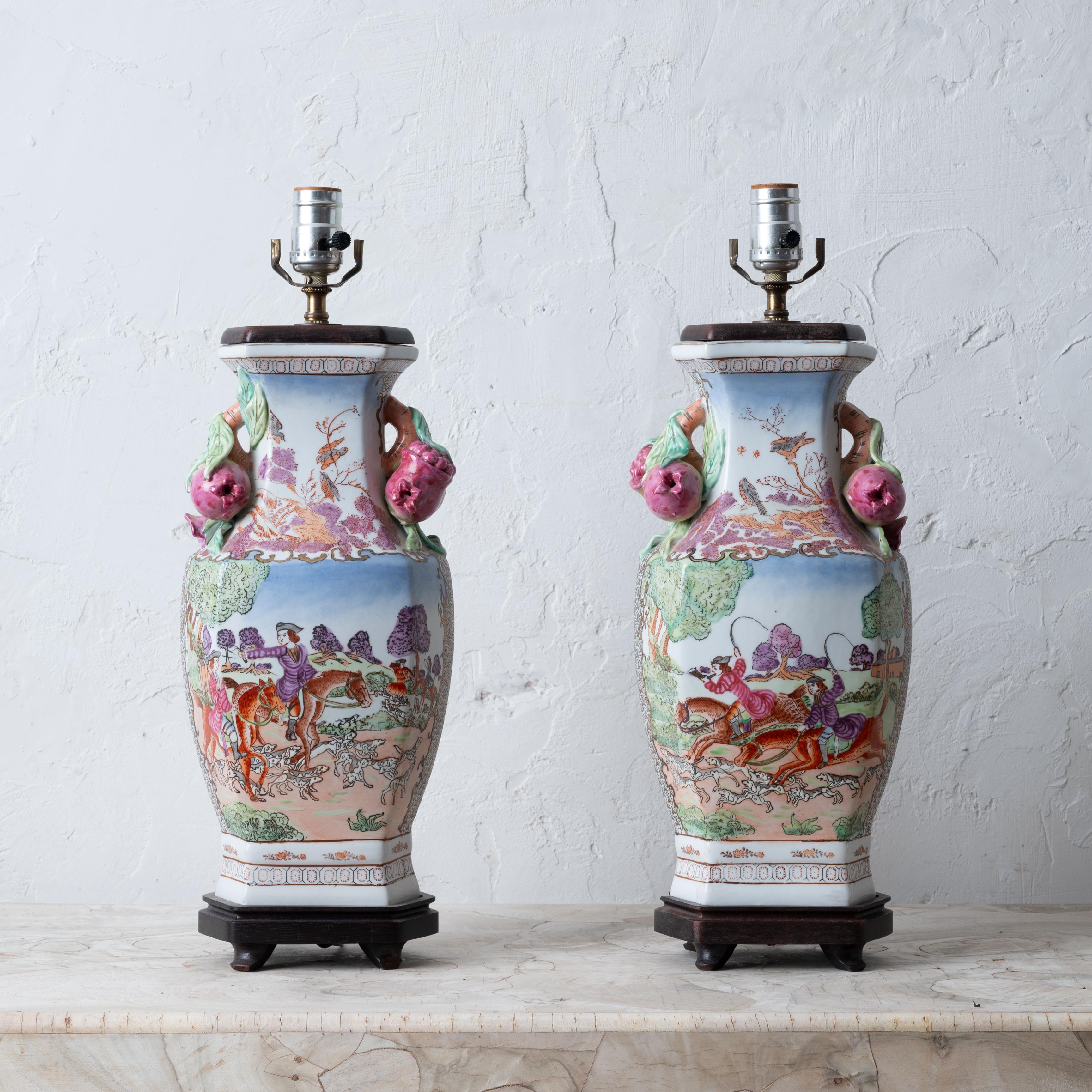 A pair of Chinese export hunt scene porcelain lamps, 20th century.



7 inches wide by 6 inches deep by 20 inches tall; 16 ½ inches to top of wooden cover



