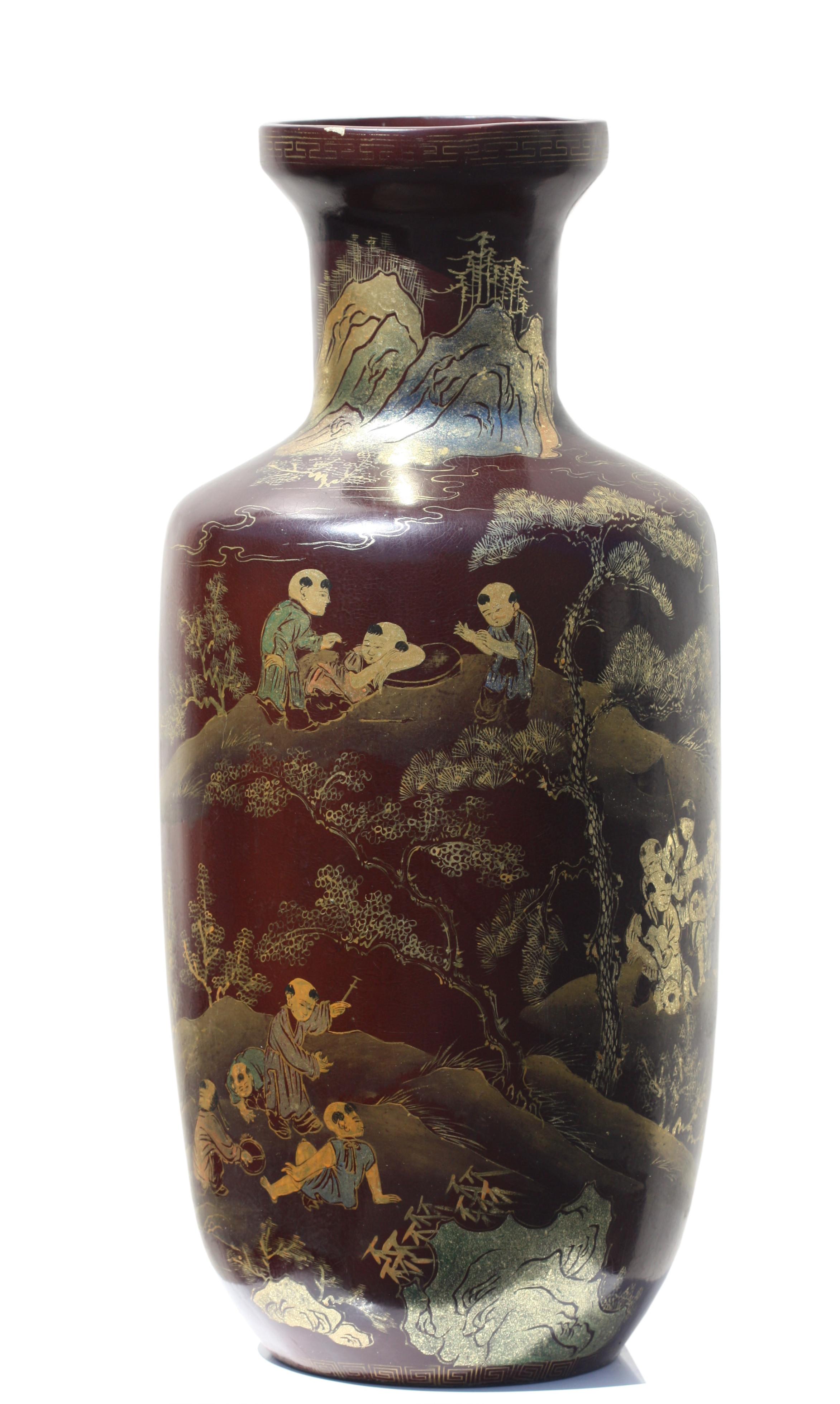 A pair of Chinese export vases of black lacquer with gold gilt decoration.
Decorated overall with chinese figures, trees and characters. 
Measures: height 23 in. (58.42 cm.) 
diameter 10 in. (25.4 cm.) 
Property of a private California