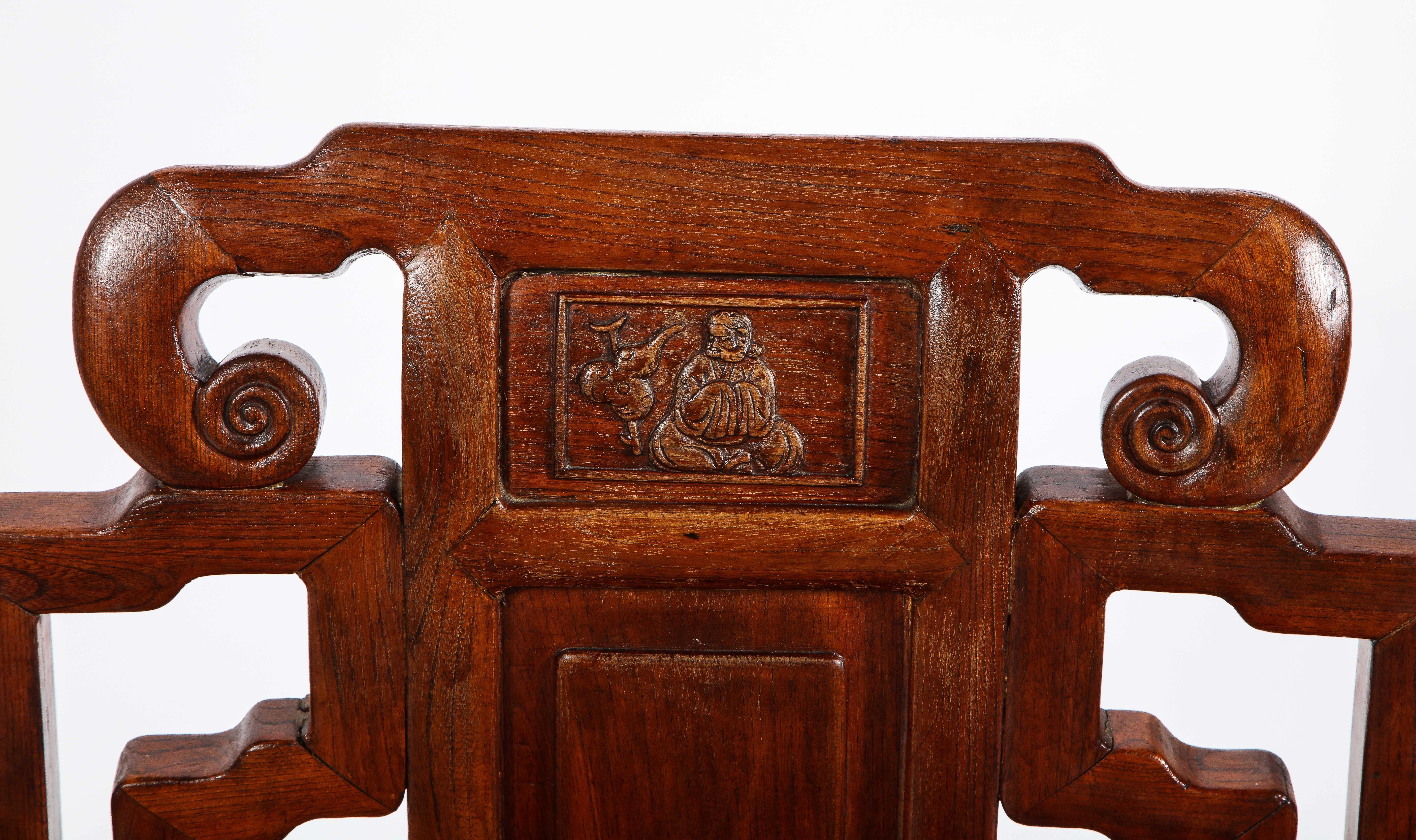 Late 19th Century Pair of Chinese Hardwood Chairs with Fretwork Designs and High Relief Panels For Sale