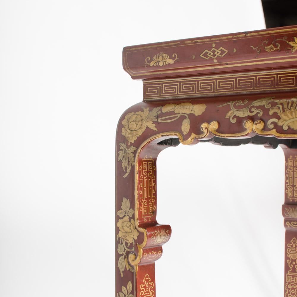 A pair of Chinese hardwood tall side tables circa 1900 with chinoiserie decorations.