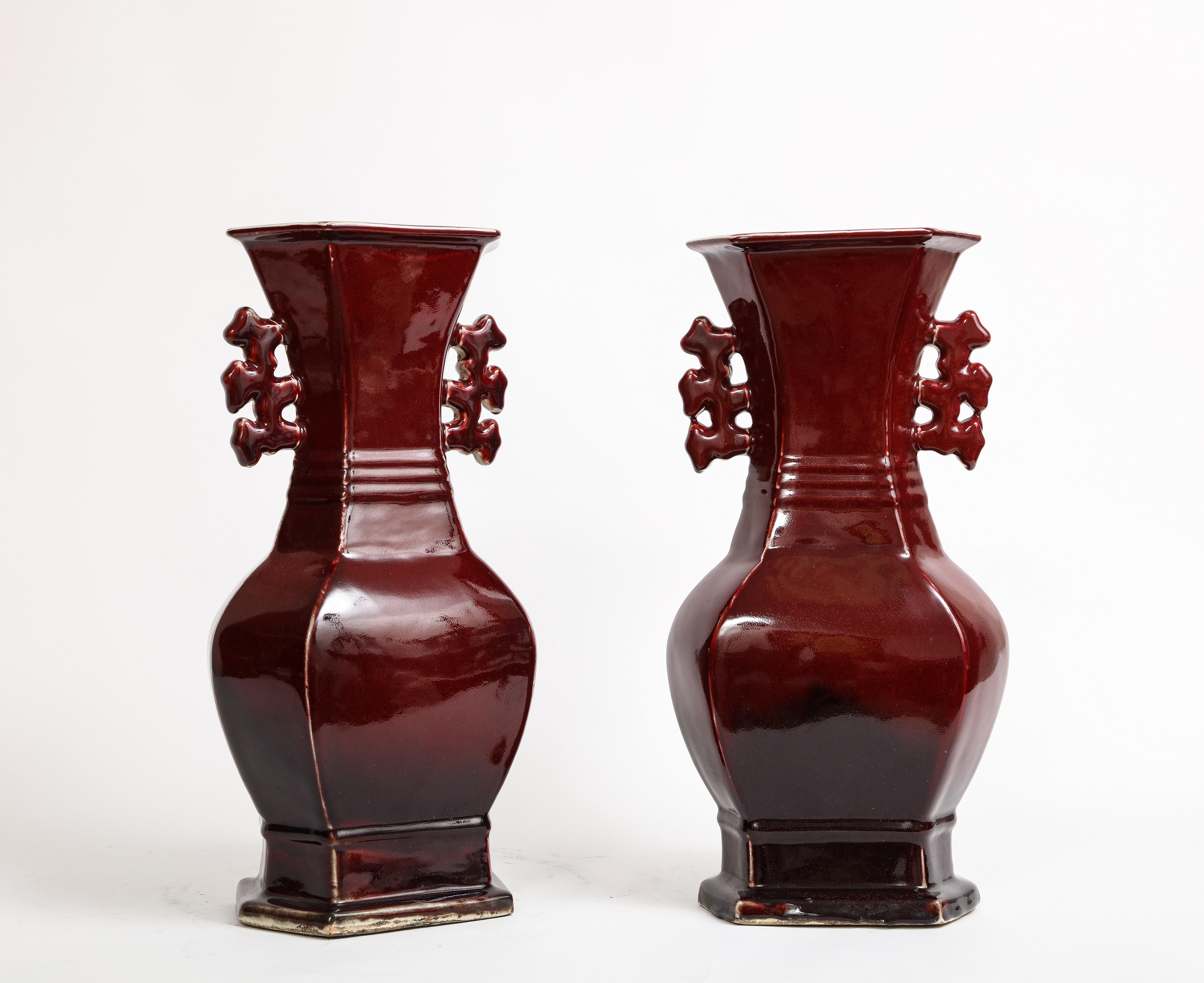 Glazed Pair of Chinese Monochrome Ox Blood Porcelain Double Handled Vases For Sale