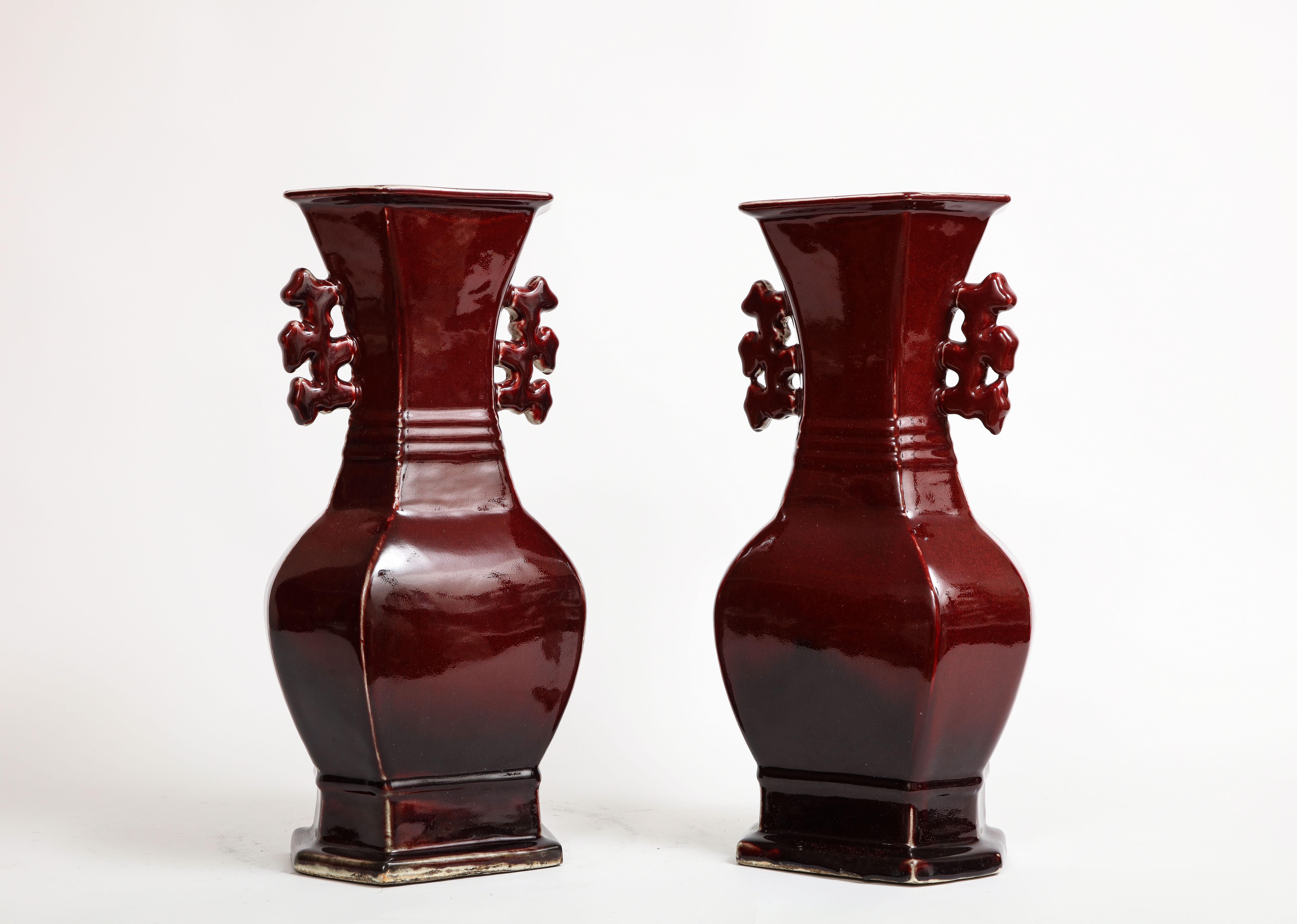 Pair of Chinese Monochrome Ox Blood Porcelain Double Handled Vases In Good Condition For Sale In New York, NY