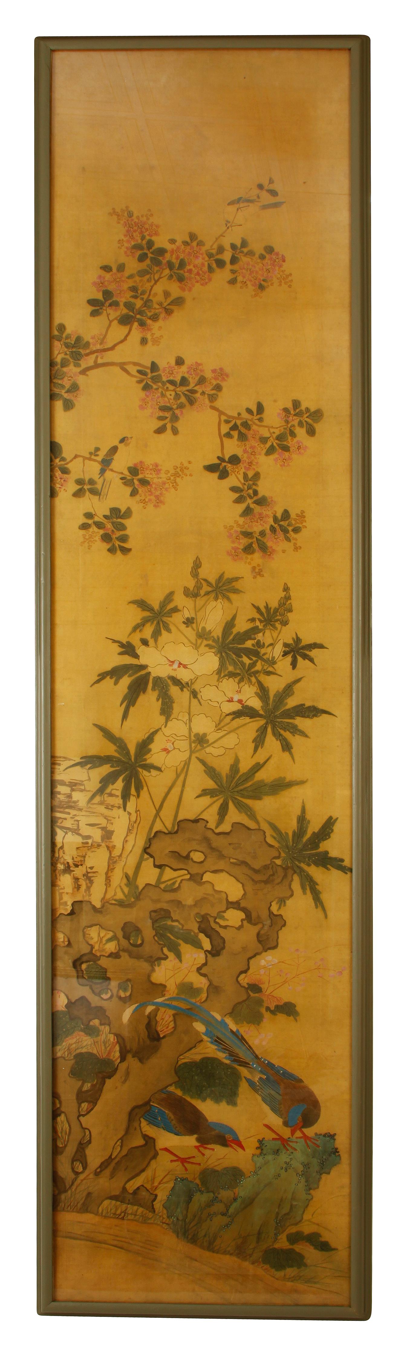 A pair of Chinese paintings on silk panels in frames, each panel a beautiful nature scene of flowers and woodland.