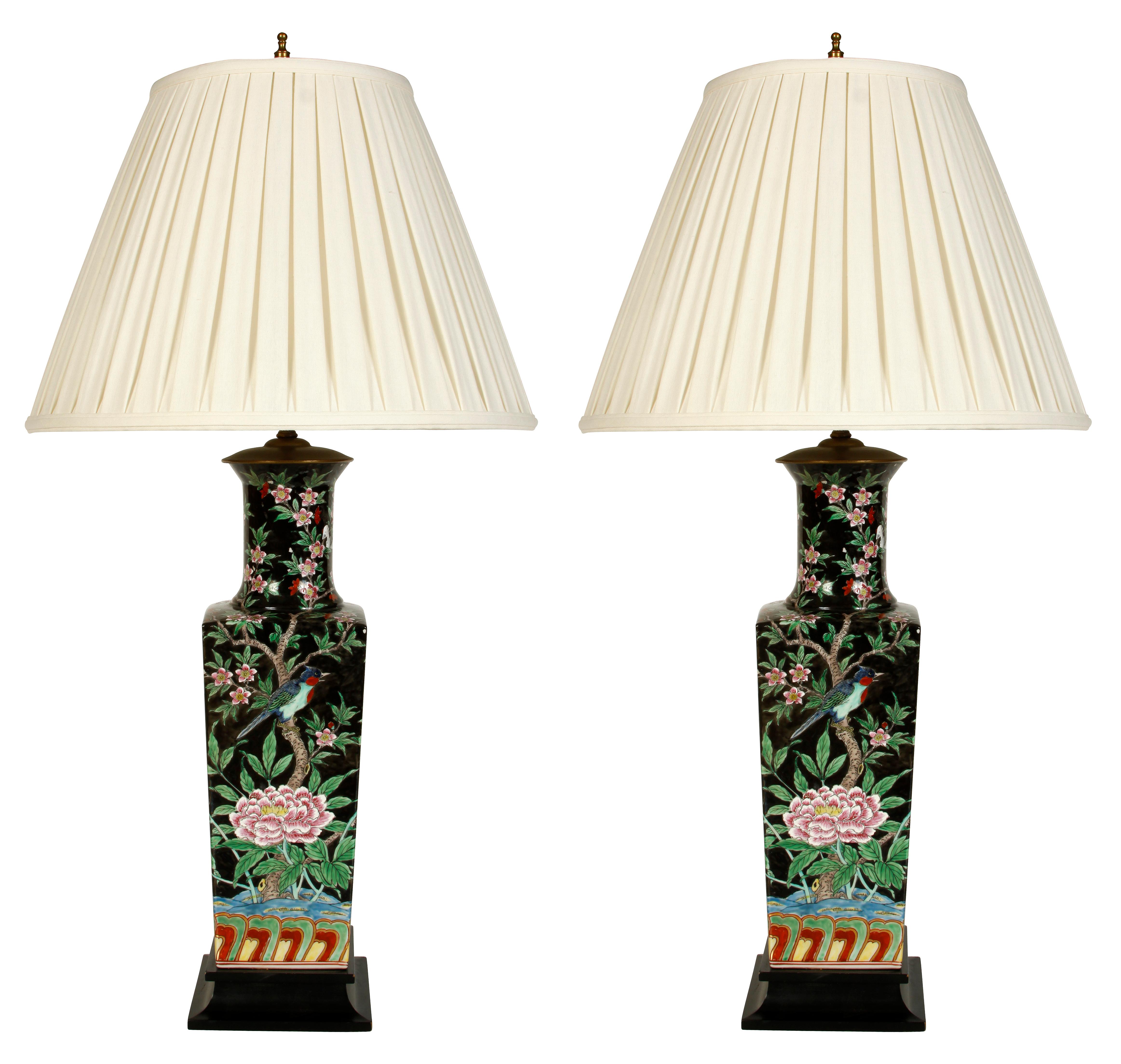 A pair of Chinese porcelain famille noir lamps.