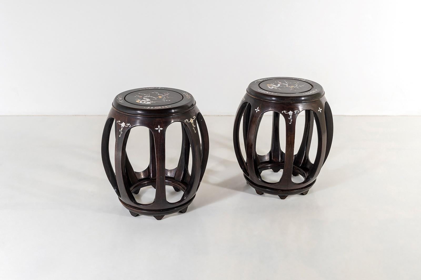 A vintage pair of very well made Chinese side tables with mother of pearl inlay.  These are a matching pair of good quality with perfect symmetry, unlike some of the cheaper examples, these have 8 equal segments and have excellent form and scale. 