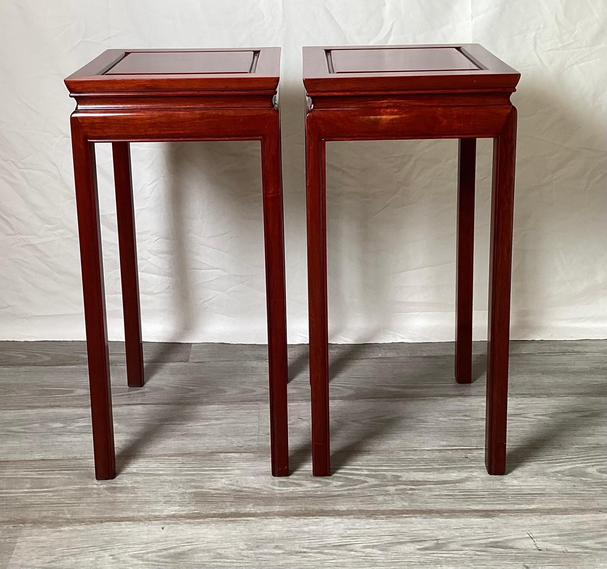 A pair of Classic Chinese hung mu wood square stands Circa mid 20th Century. Each 12 inches square, 25 inches tall.