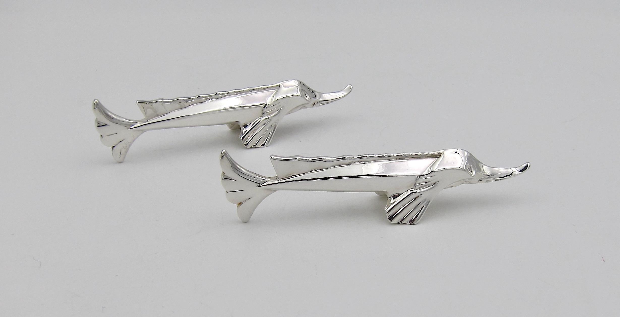 A boxed pair of silver plated Art Deco knife rests from Christofle of Paris. Originally commissioned between 1920 and 1930 by the French shipping line Compagnie Générale Transatlantique and designed by sculptor Edouard Marcel Sandoz for Maison
