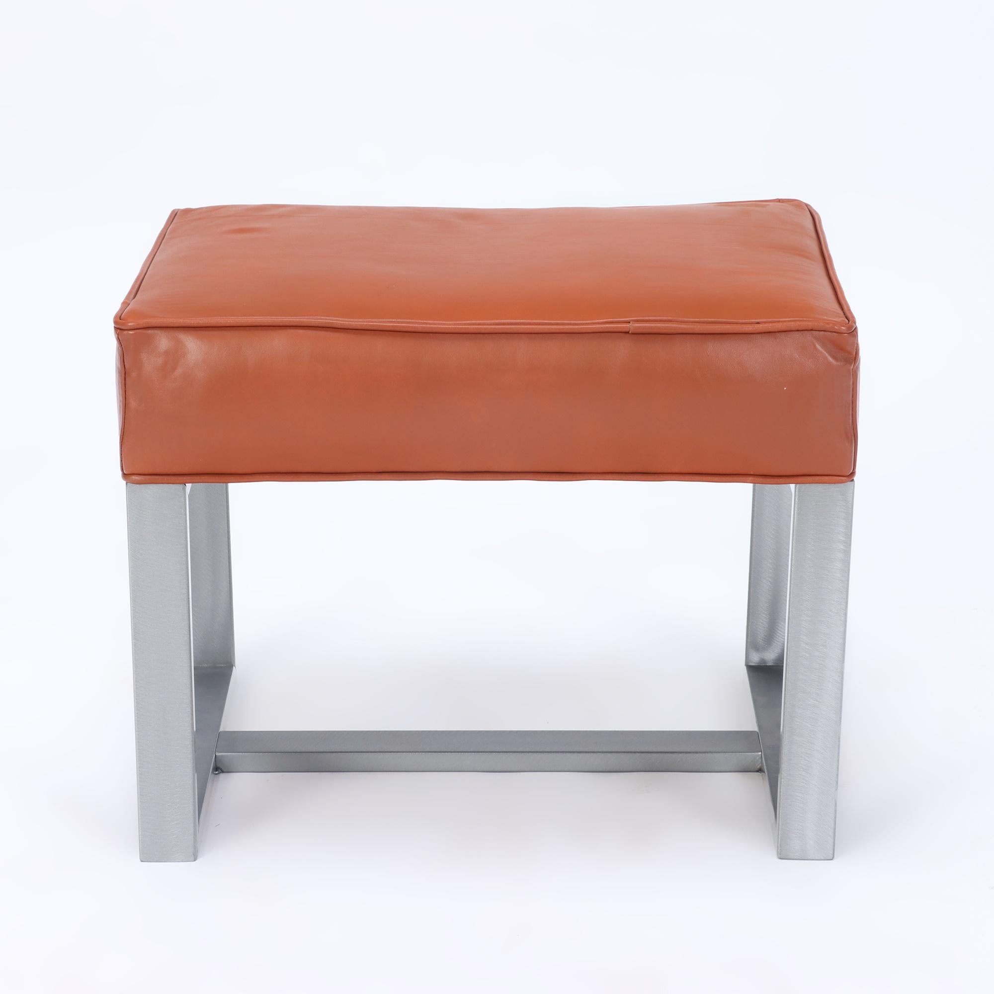 An elegant pair of chrome and leather covered benches or small stools. Contemporary.