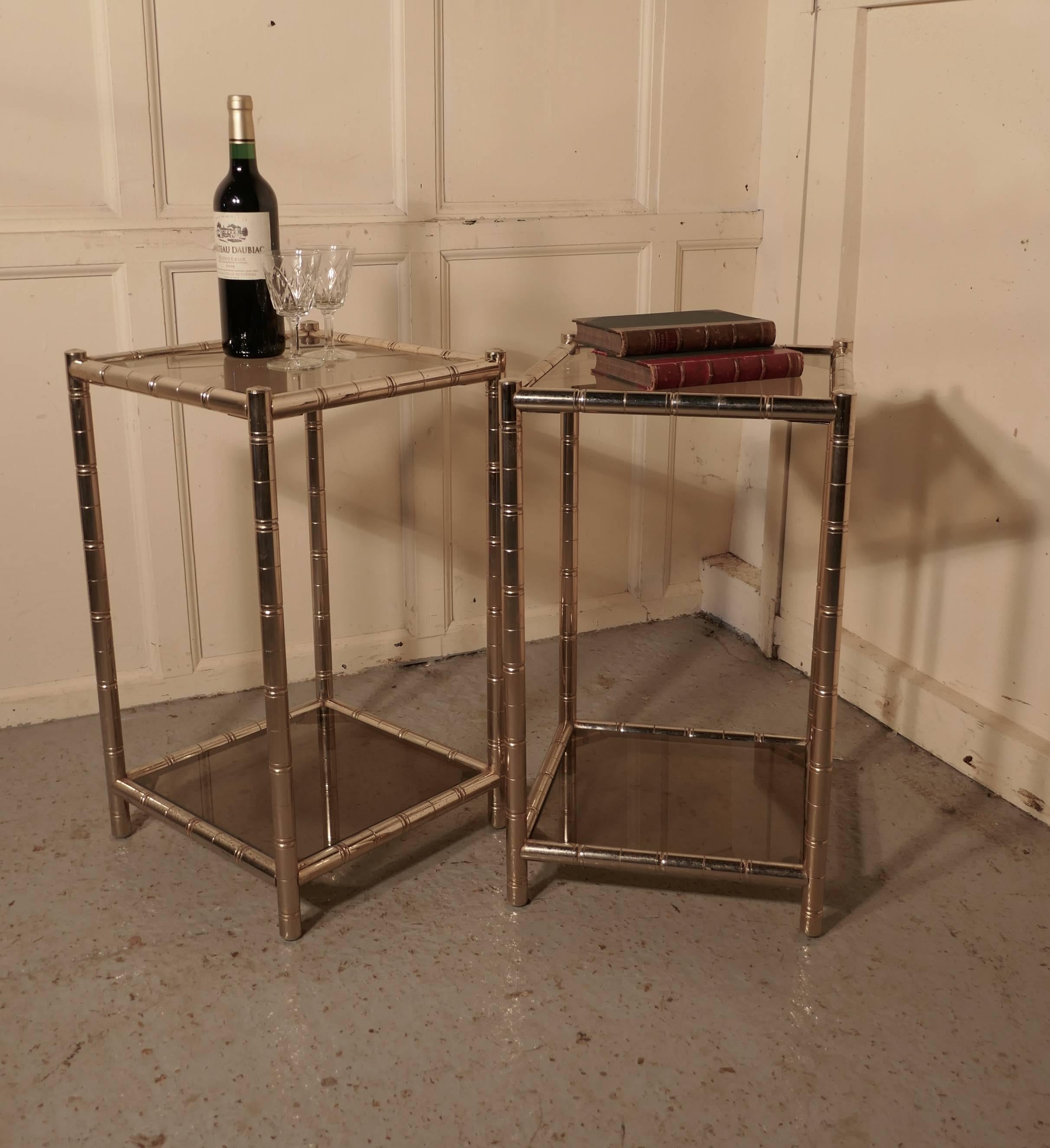 A pair of chrome Art Deco occasional tables or bedside tables

A useful pair of tables, they are made in chrome which has a simulated bamboo effect, both the top and the under tier are in smoked glass
The pair are in good condition with very
