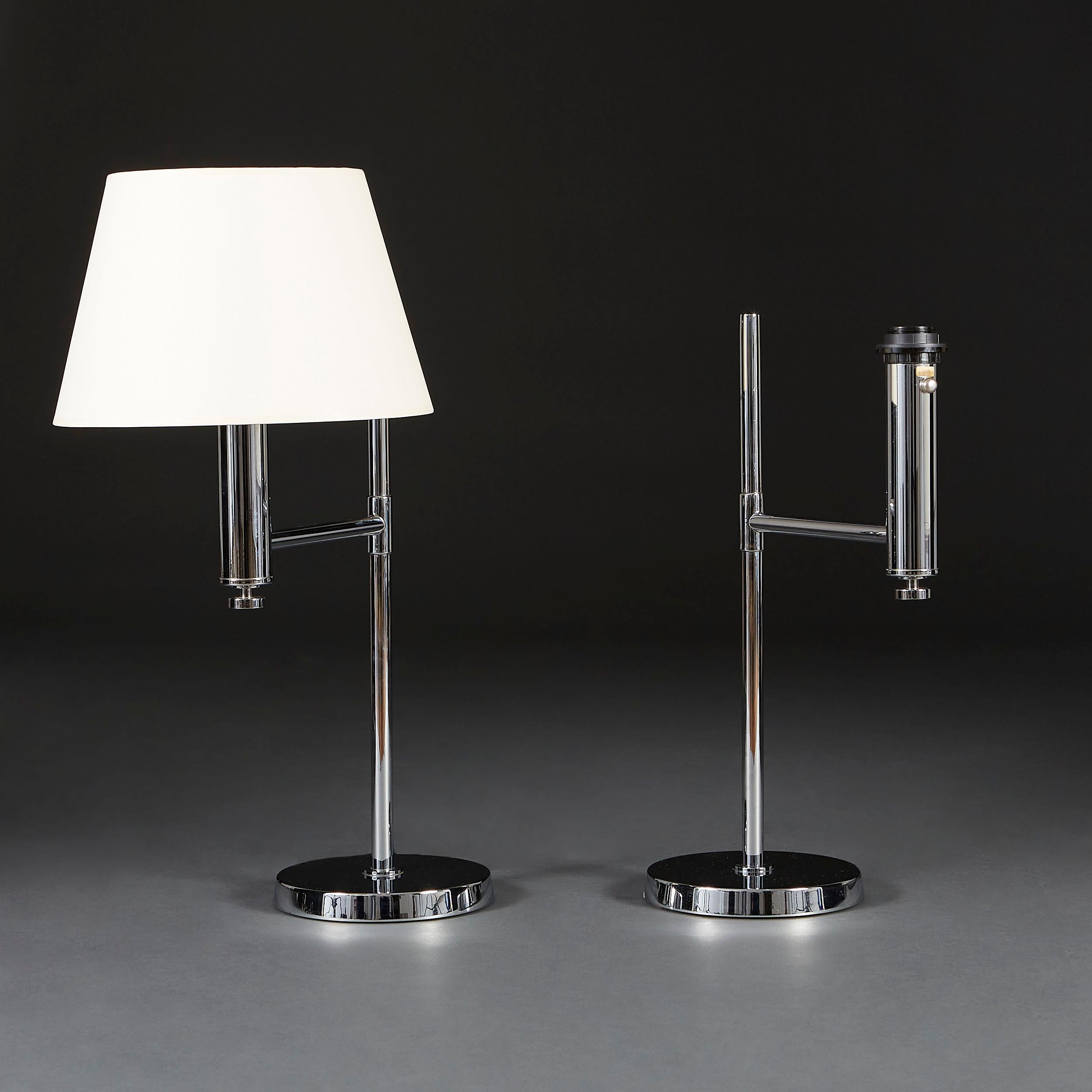 A pair of unusual chrome metal lamps with U-form extended arms and circular bases.

Please note: lampshades not included.

Currently wired for the UK.