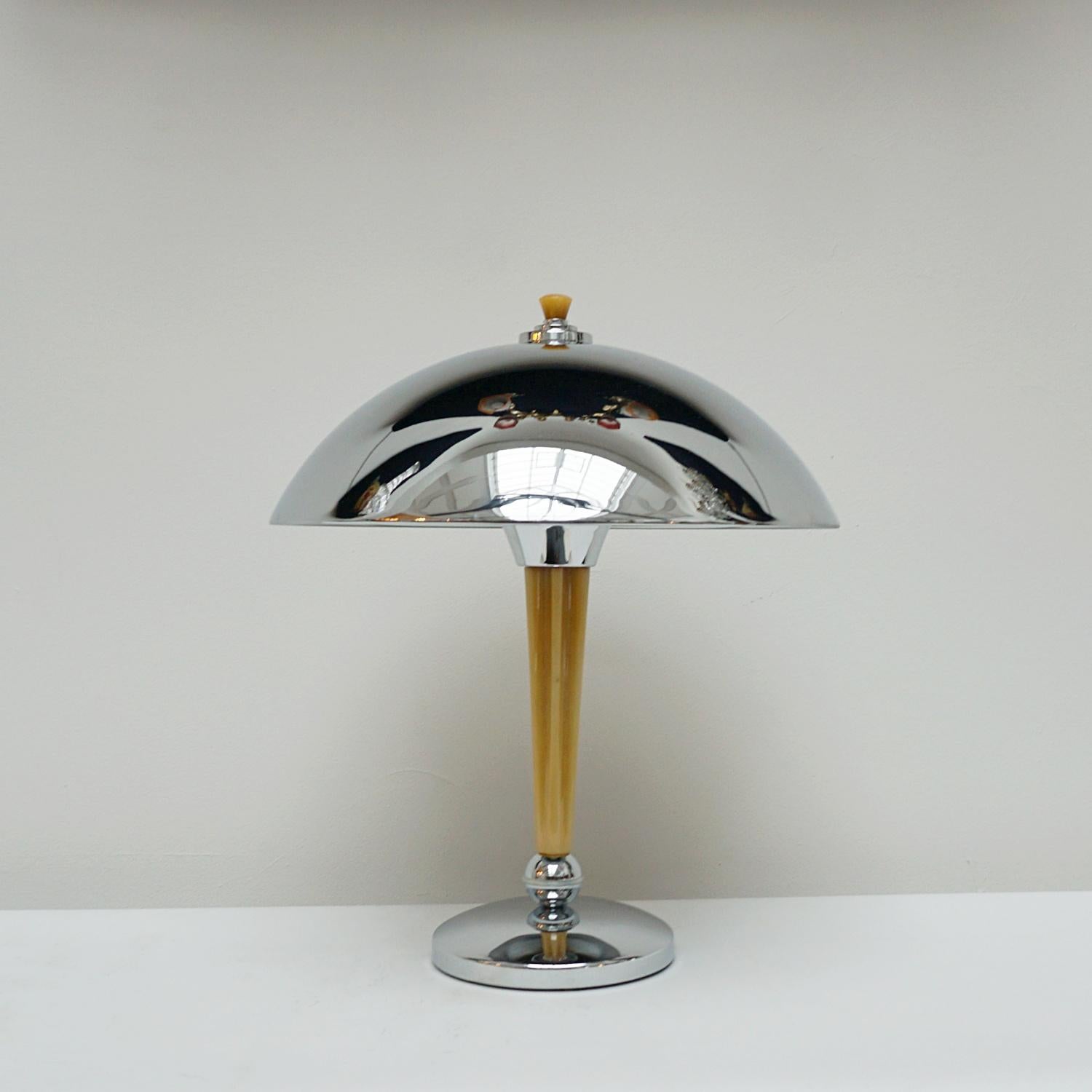 A pair of Art Deco style dome lamps. Fluted tube of marbled yellow bakelite stem, set over a chromed metal base. Yellow finial topped chromed metal shade. 

Dimensions: H 44cm Diameter of shade: 35cm, of base: 16cm

Item Number: J294

All of our