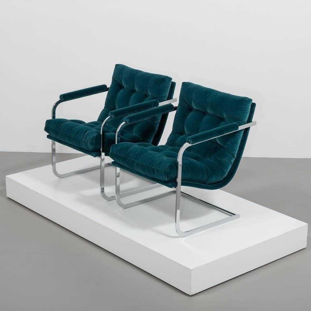 A Pair of Chromium Steel Framed Peacock Velvet Upholstered Cantilevered Armchairs 1960s 

Fully reupholstered

NB: Price includes 20% VAT which is removed for items shipped outside the EU