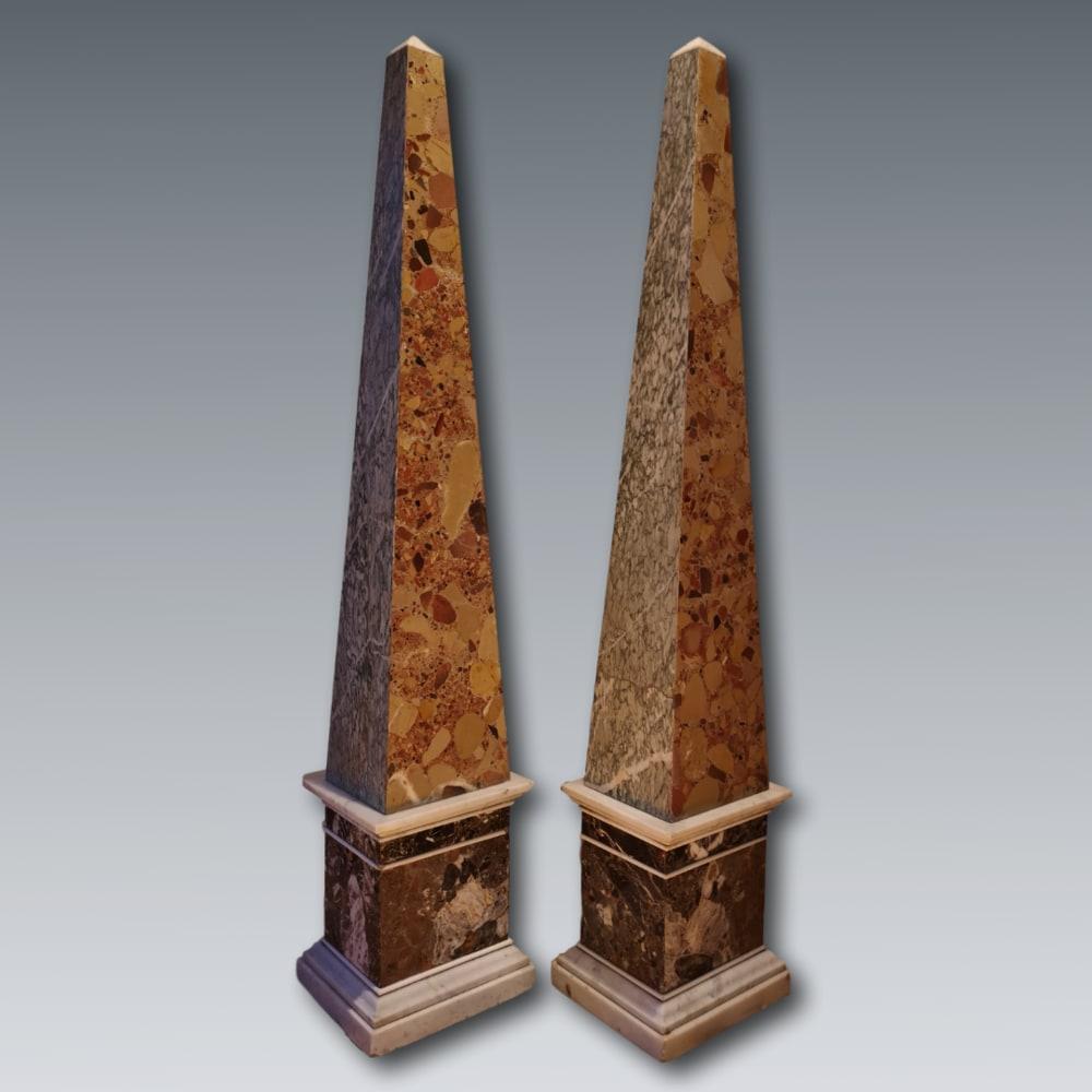 A pair of Cipollino della Versilia and Brèche d'Alep marble obelisks, circa 1800, significant ‘Grand Tour’ souvenirs, of large-scale and superbly faceted to reveal the fine colouration and patterning of the marble, raised on squared and stepped