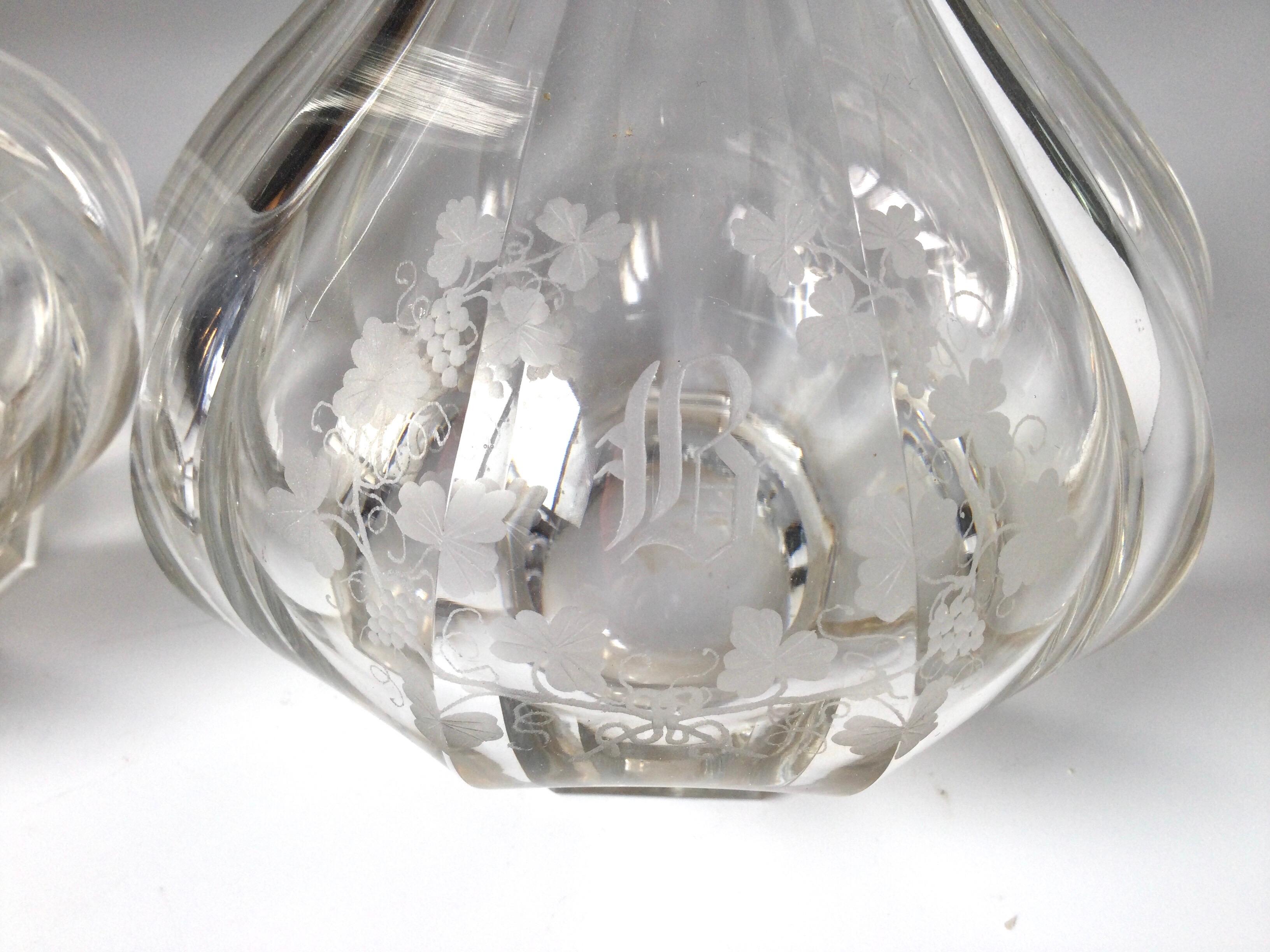 American H.P. Sinclaire & Co. pair of crystal decanter and stopper - circa 1900-1910. Elegant form with delicate engraved detail with the initial B on the fronts... Look at the close ups for detail.

    