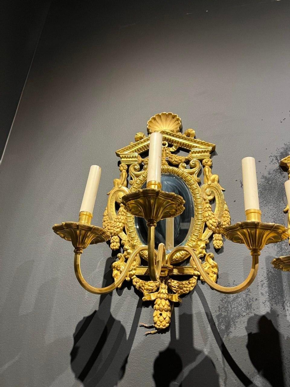 Neoclassical 1900's Caldwell Neoclassic Gilt Bronze and Mirror Sconces 3 Lights For Sale