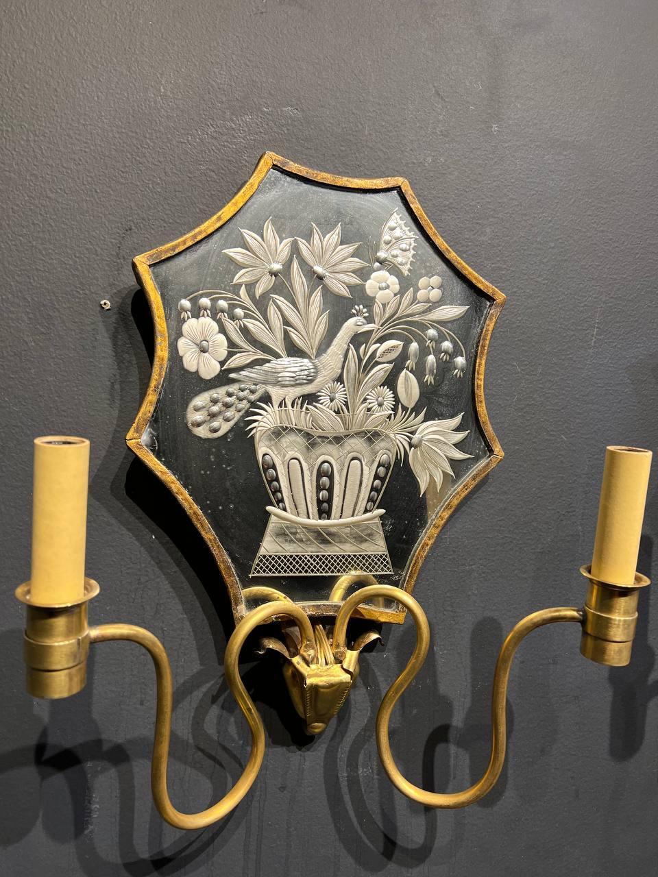 A pair of circa 1920's Caldwell gilt bronze sconces with etched mirror backplate, birds design