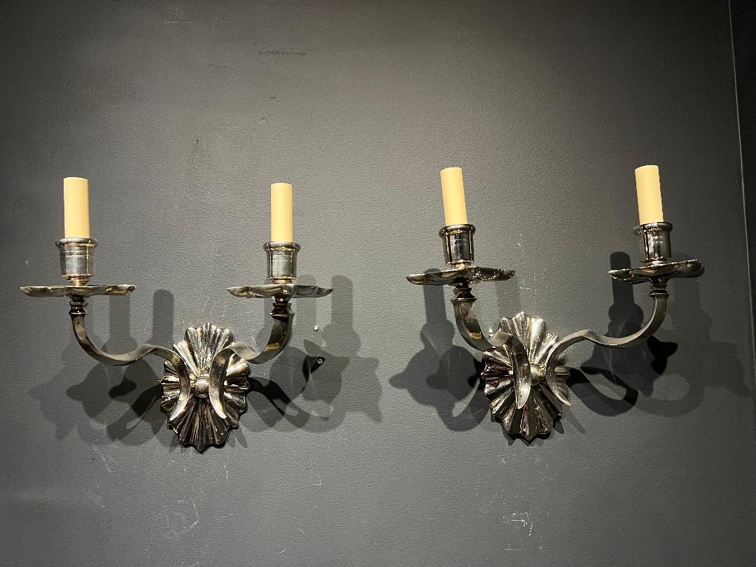 A pair of circa 1920's Caldwell silver plated bronze sconces with 2 lights