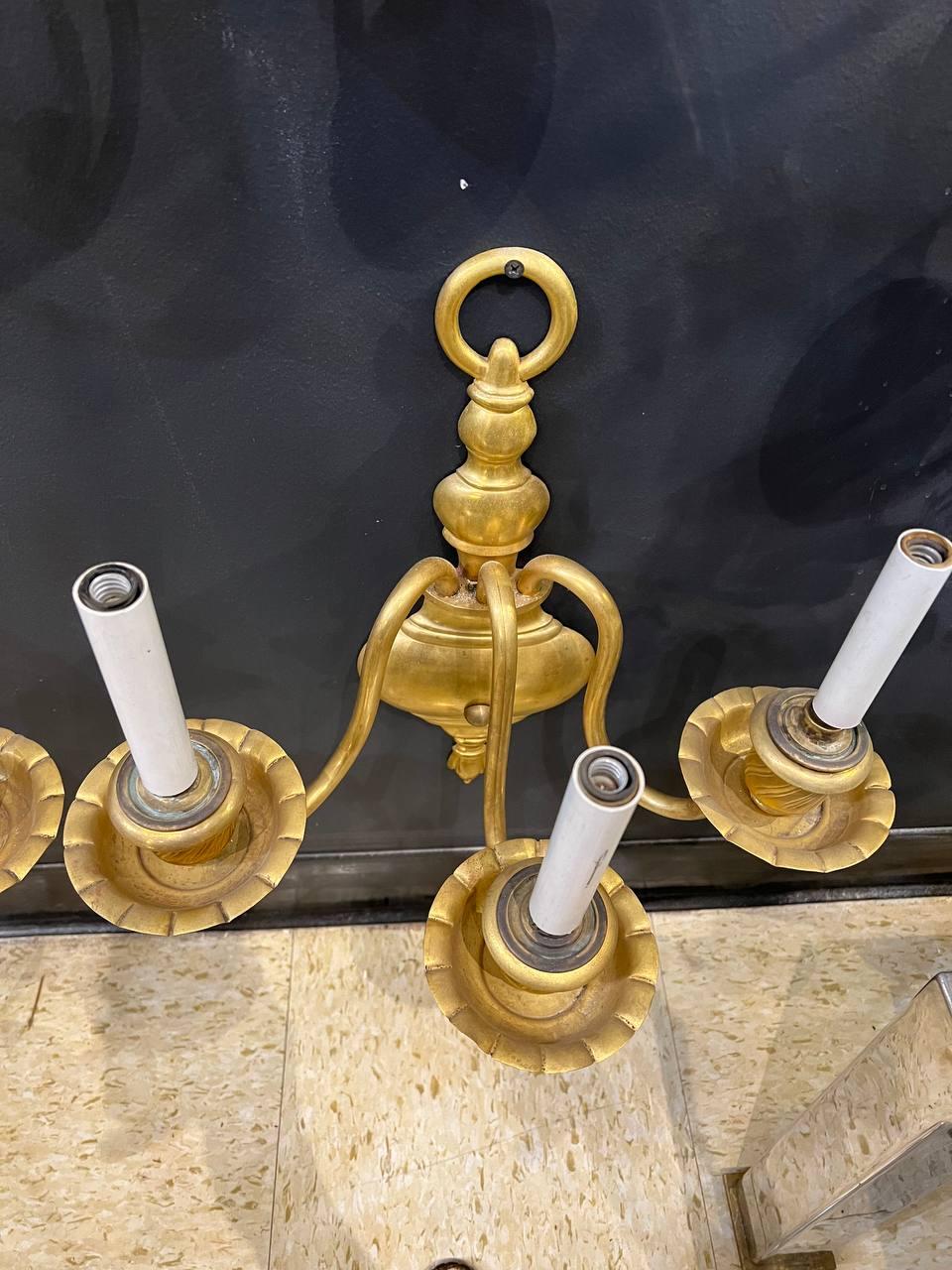 A pair of circa 1920's Caldwell gilt bronze 3 lights sconces 