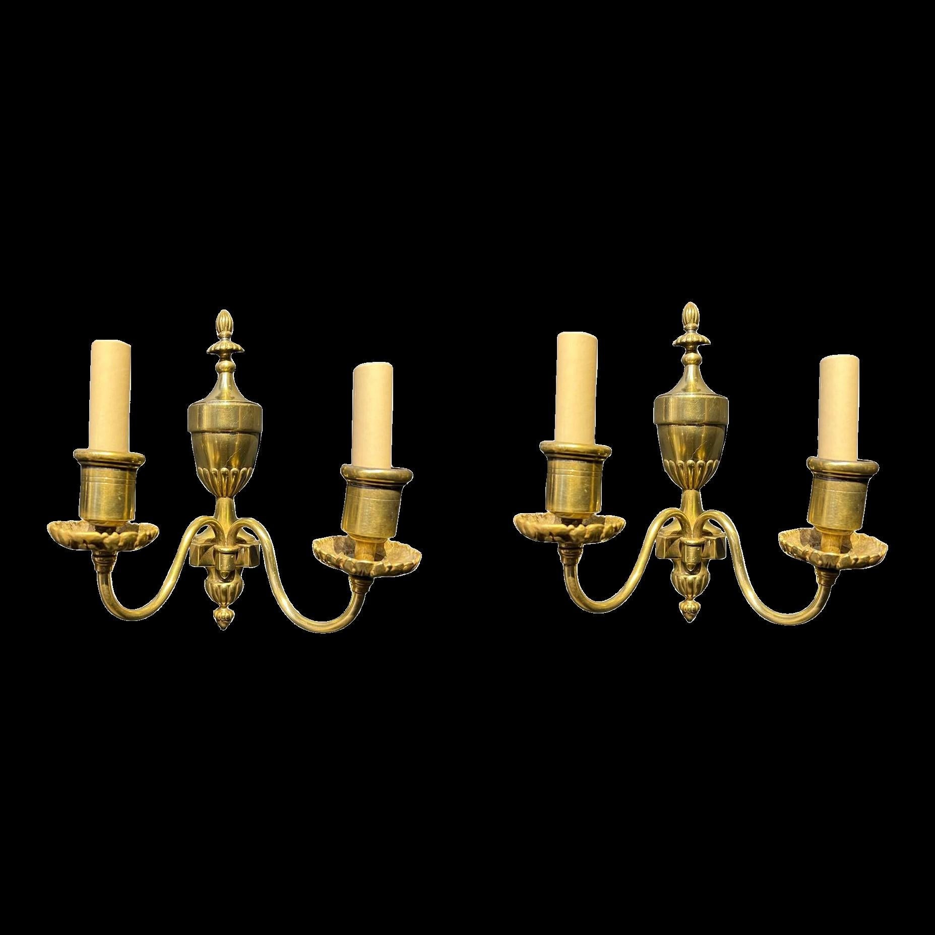 A pair of circa 1920's Caldwell small gilt bronze double light sconces. Original finish