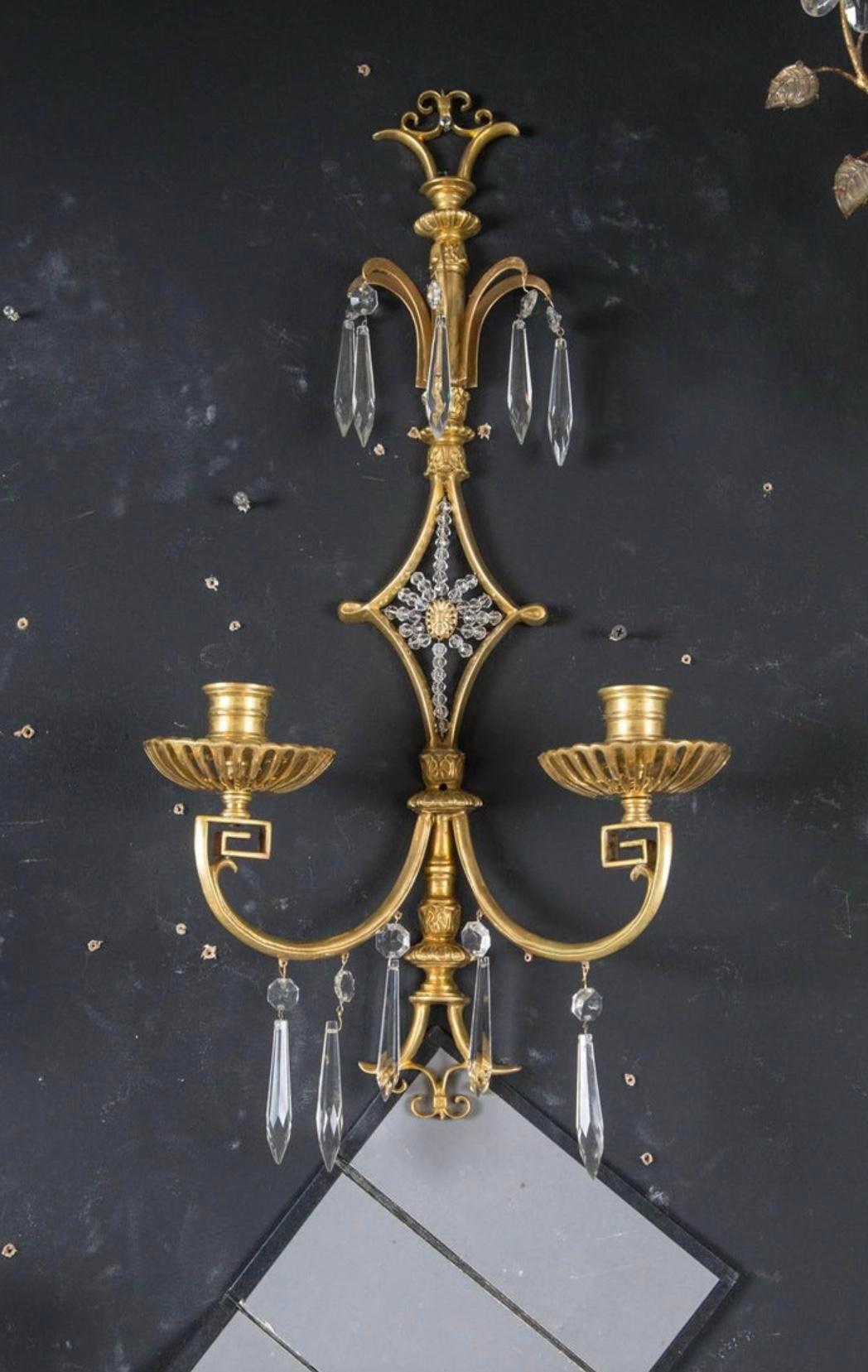 A pair of circa 1920's Caldwell gilt bronze double light sconces with crystals