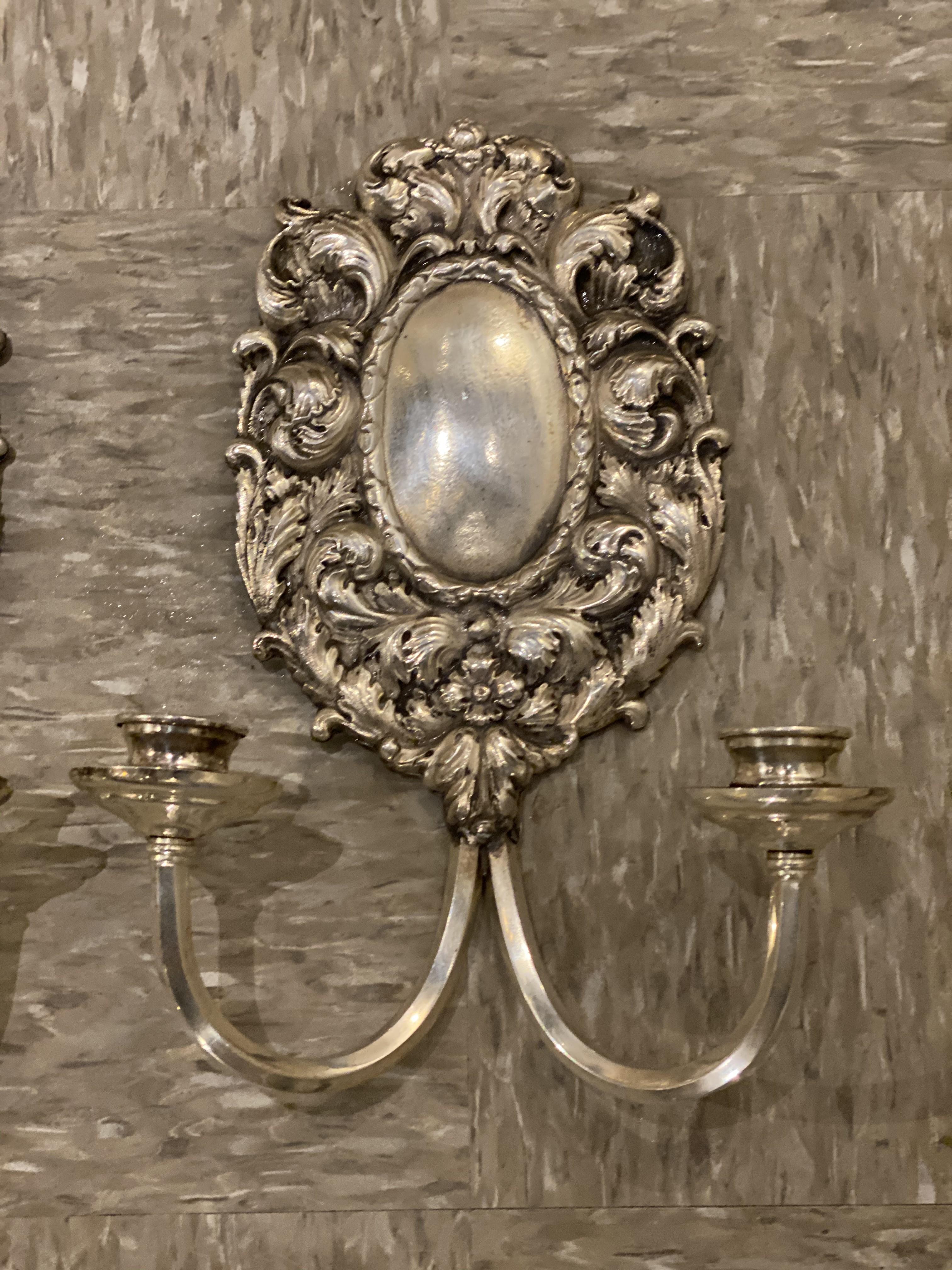 A pair of circa 1920's Caldwell silver plated bronze sconces with waves design, two lights
