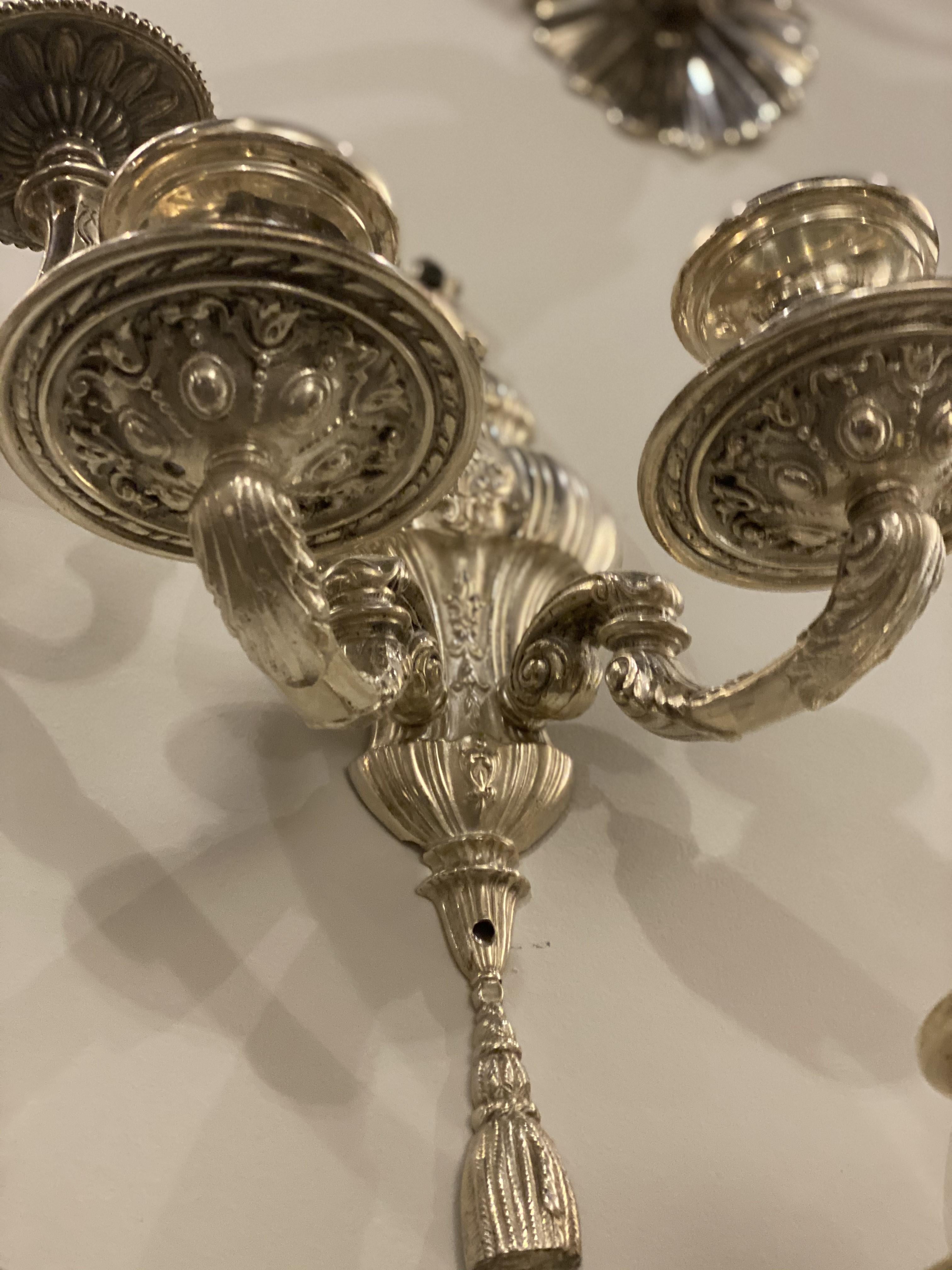 A pair of circa 1920's Caldwell silver plated sconces  
