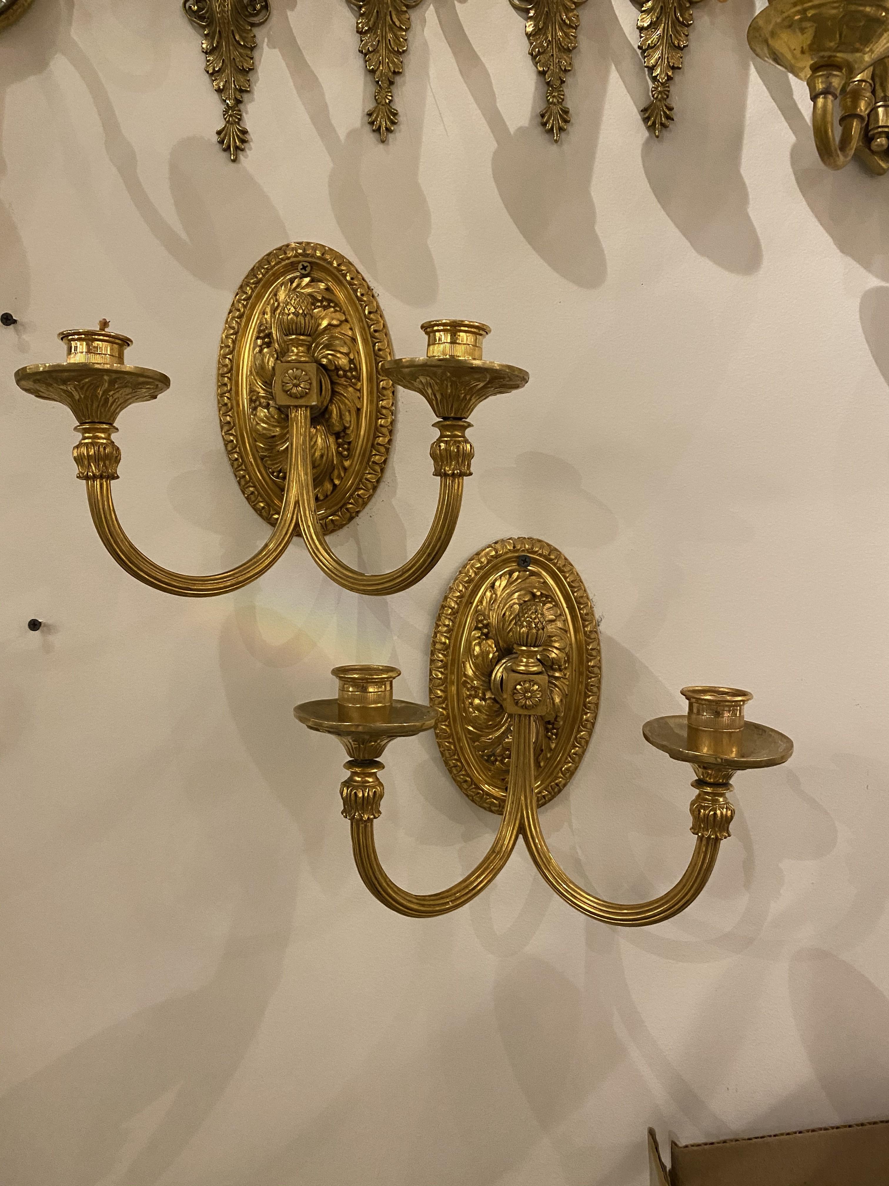 A pair of circa 1920's Caldwell gilt bronze sconces with 2 lights