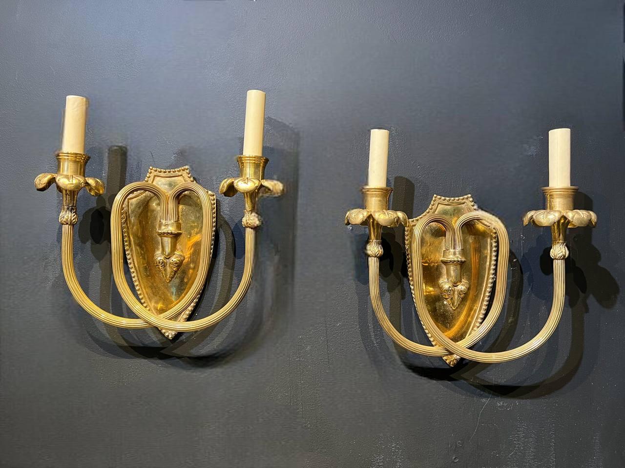 Neoclassical 1920’s Caldwell Bronze Sconces with Scrolled Arms For Sale