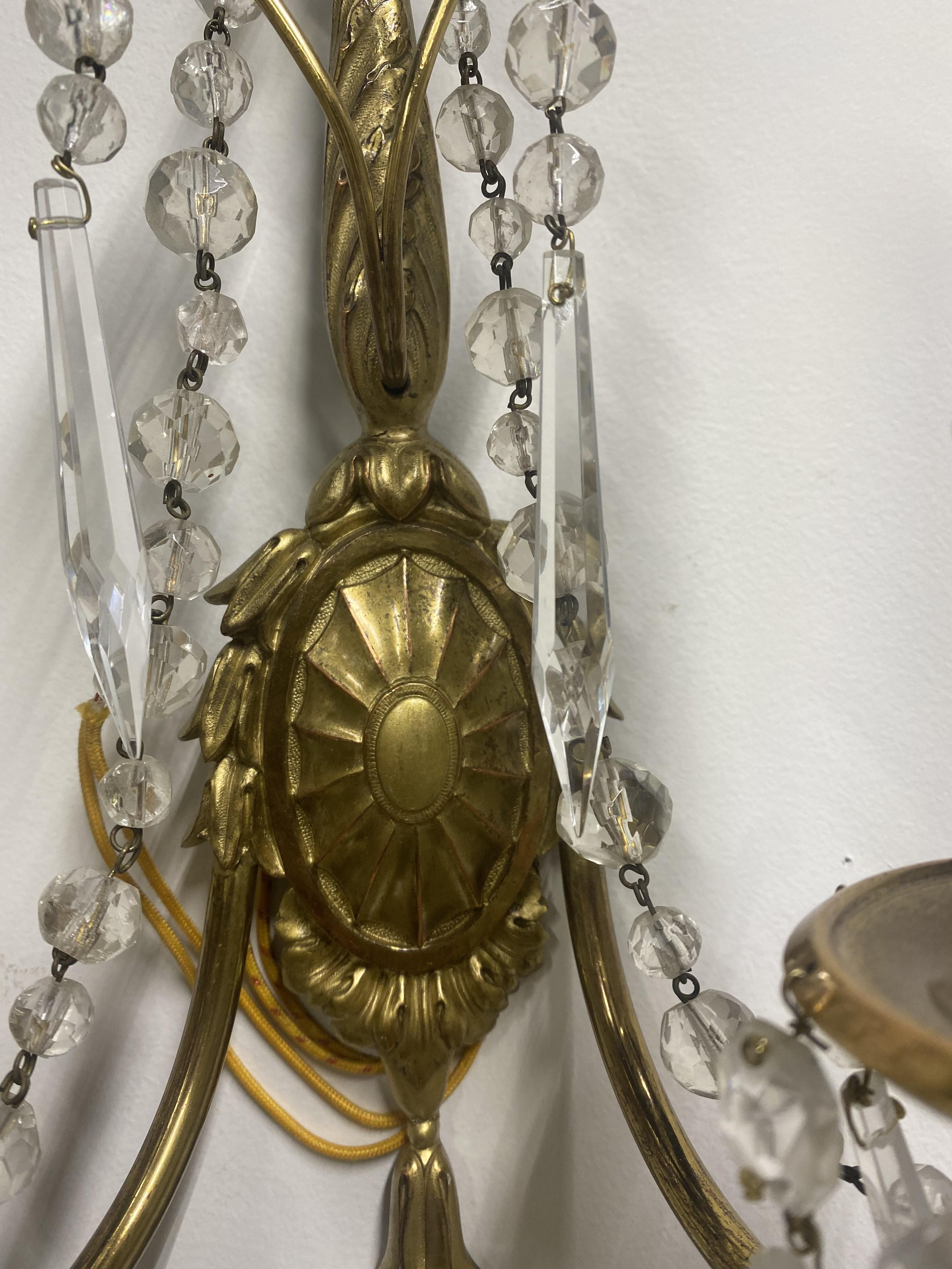Adam Style 1920's Caldwell Gilt Bronze Sconces with Crystal Hangings For Sale