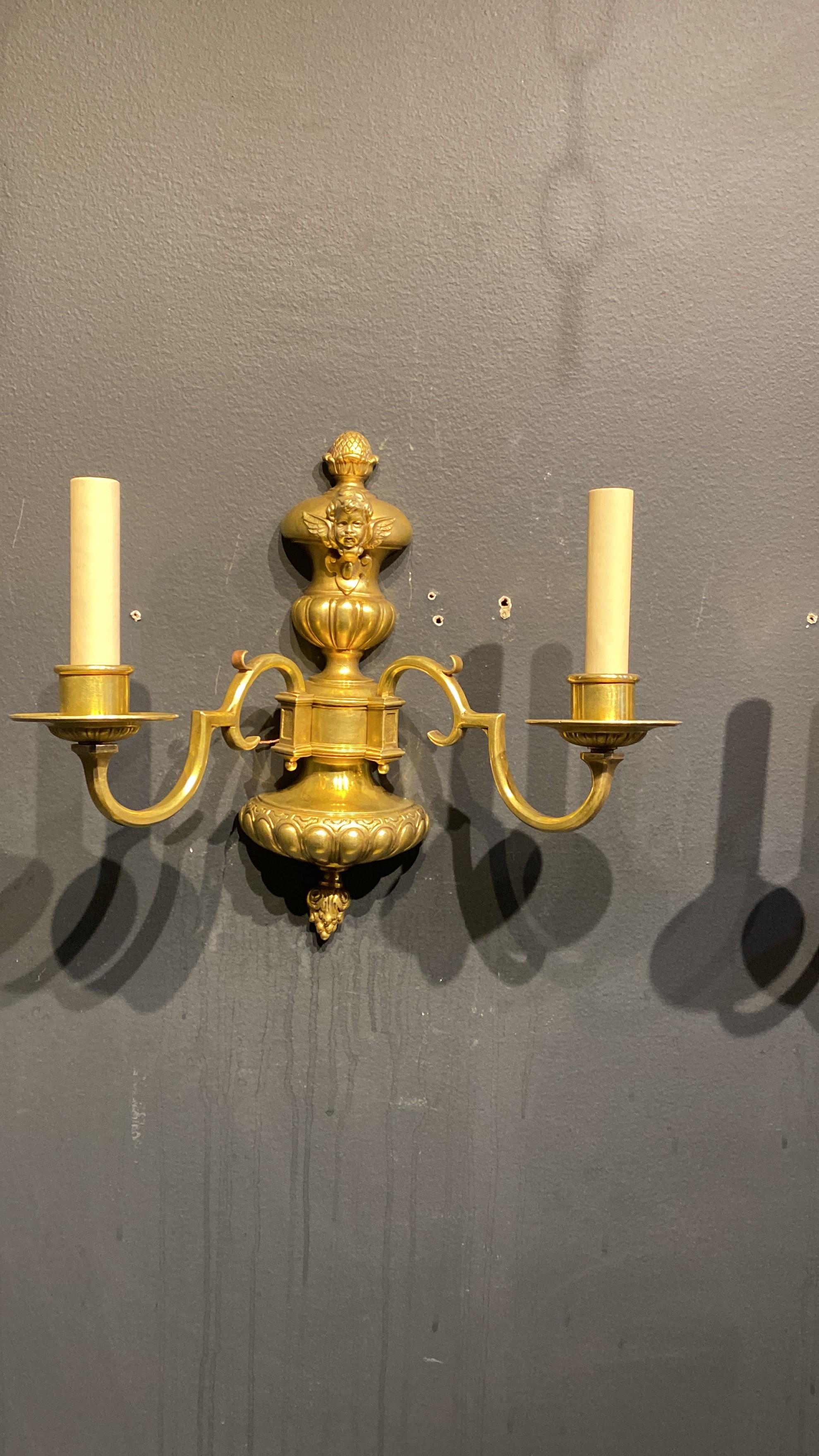 Pair 1920's Caldwell Gilt Bronze Sconces with Cherub In Good Condition For Sale In New York, NY