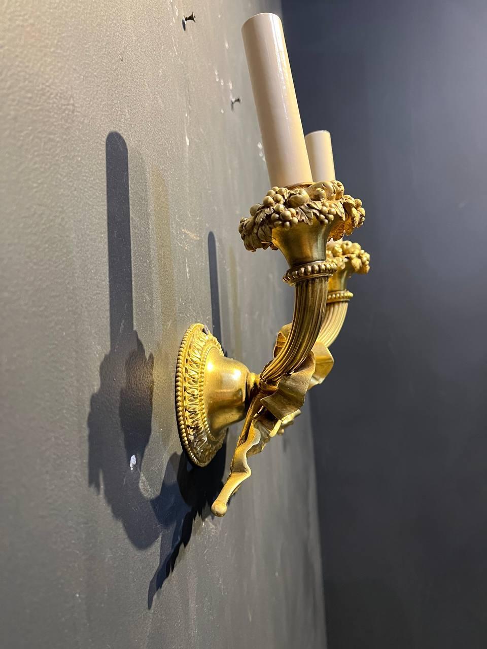 Early 20th Century Pair of 1920's Caldwell Gilt Bronze Sconces with Ribbon For Sale