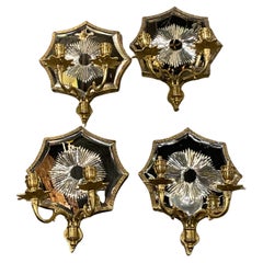 a pair of circa 1920's Caldwell sconces with mirrored backplate