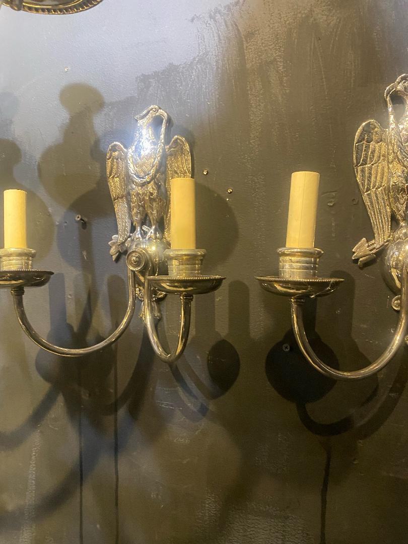 A pair of circa 1920's Caldwell federal style silver plated sconces with eagles