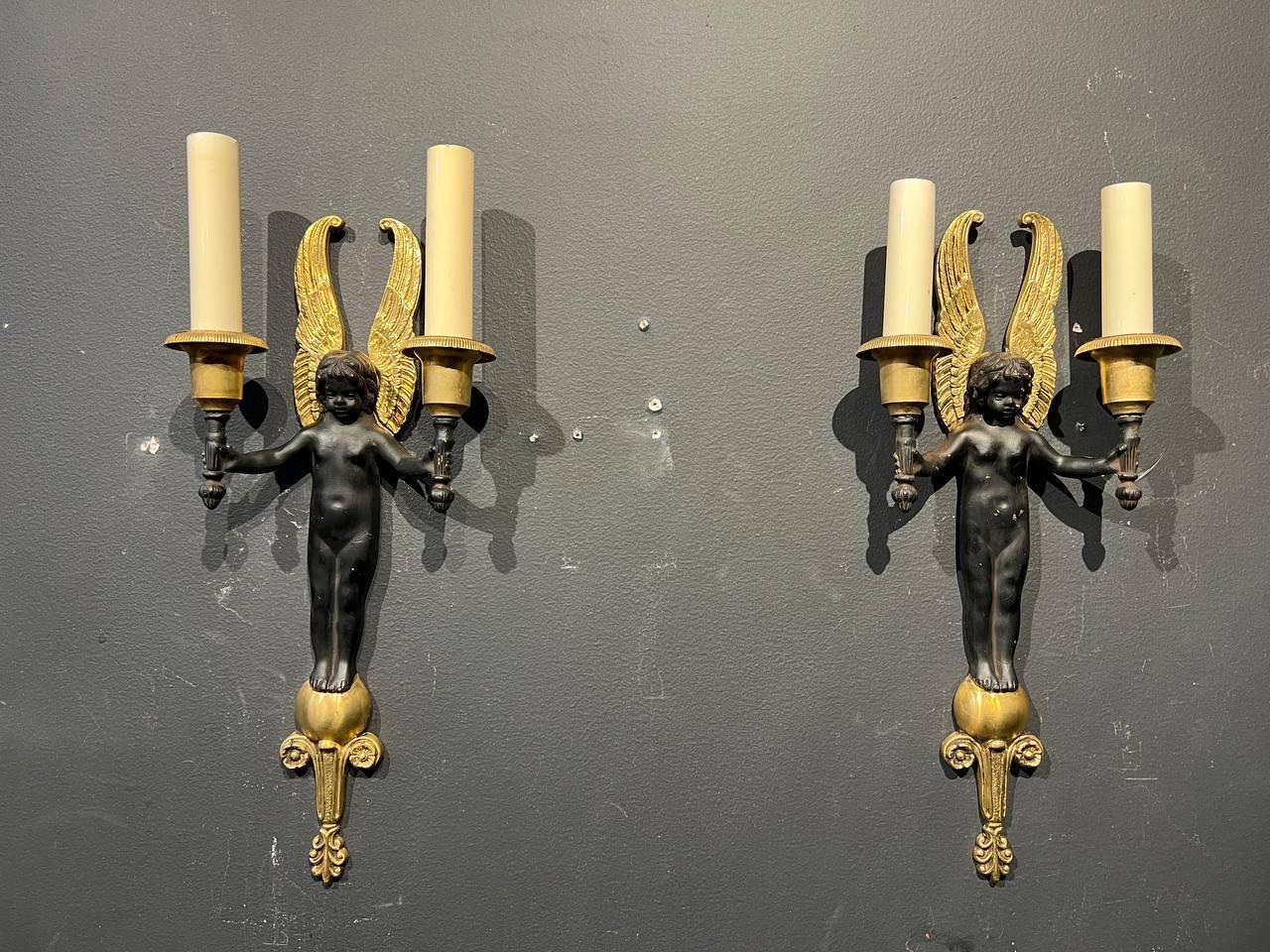 a pair of circa 1920's empire style sconces with Blackmoore putti.
