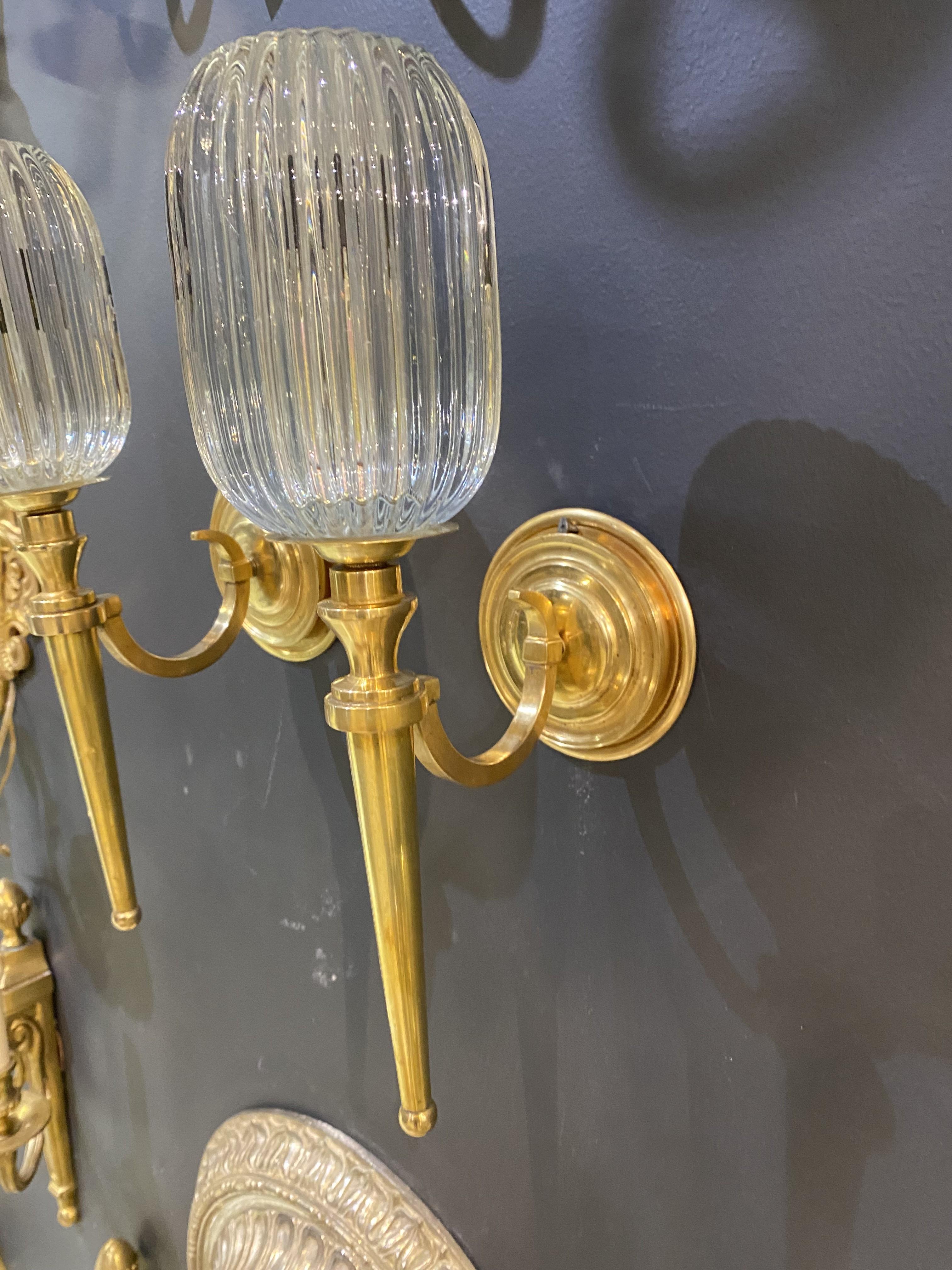American 1920's Caldwell Gilt Bronze One Light Sconces with Reed Glass For Sale