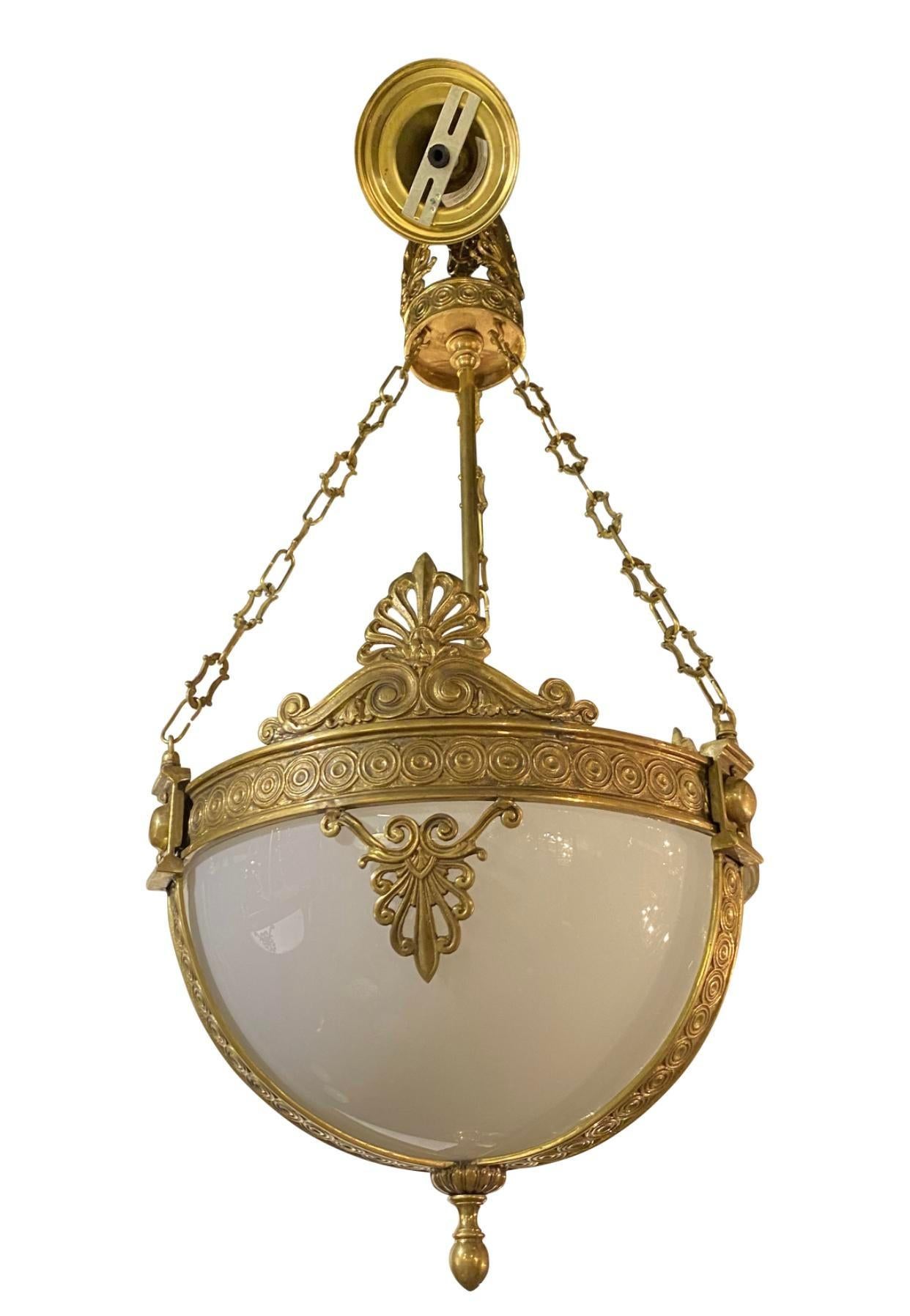 A circa 1920's Caldwell neoclassic style light fixtures with beautiful Opaline glass inset.