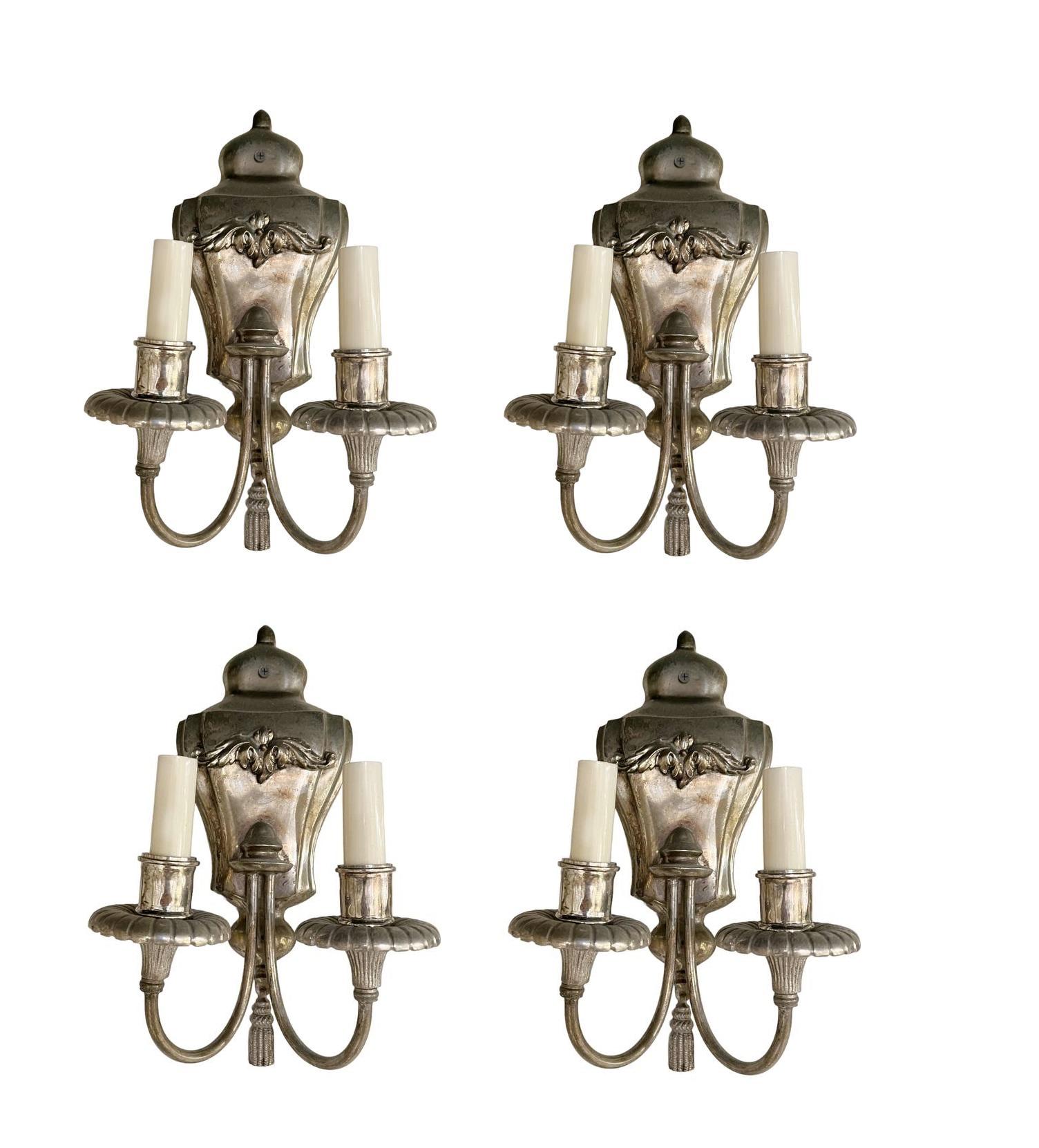 A pair of circa 1930's English silver plated sconces with two lights