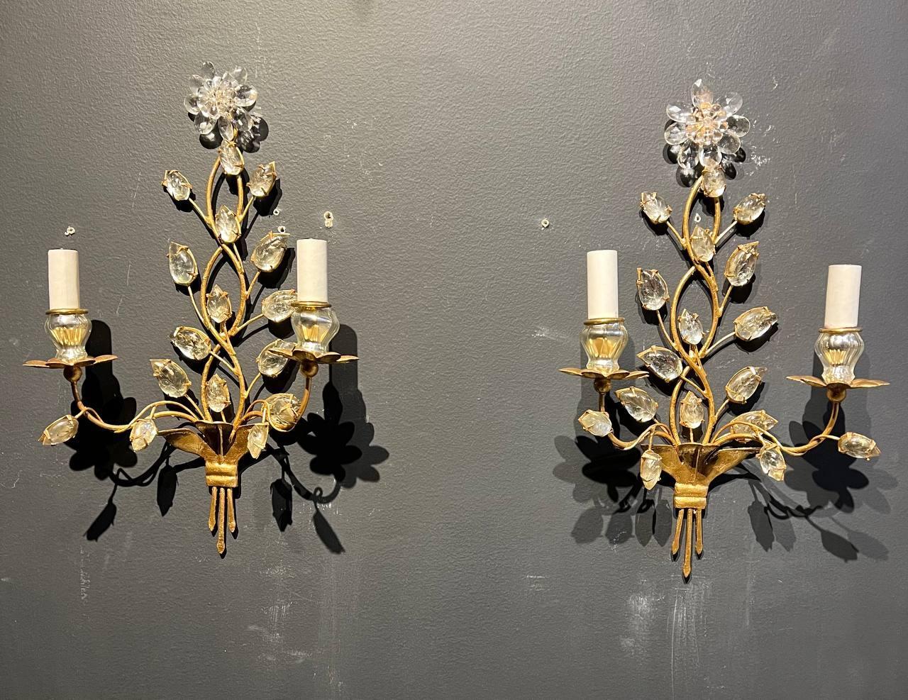 A pair of circa 1930's French Bagues gilt metal sconces with glass leaves from a Paris Hotel.